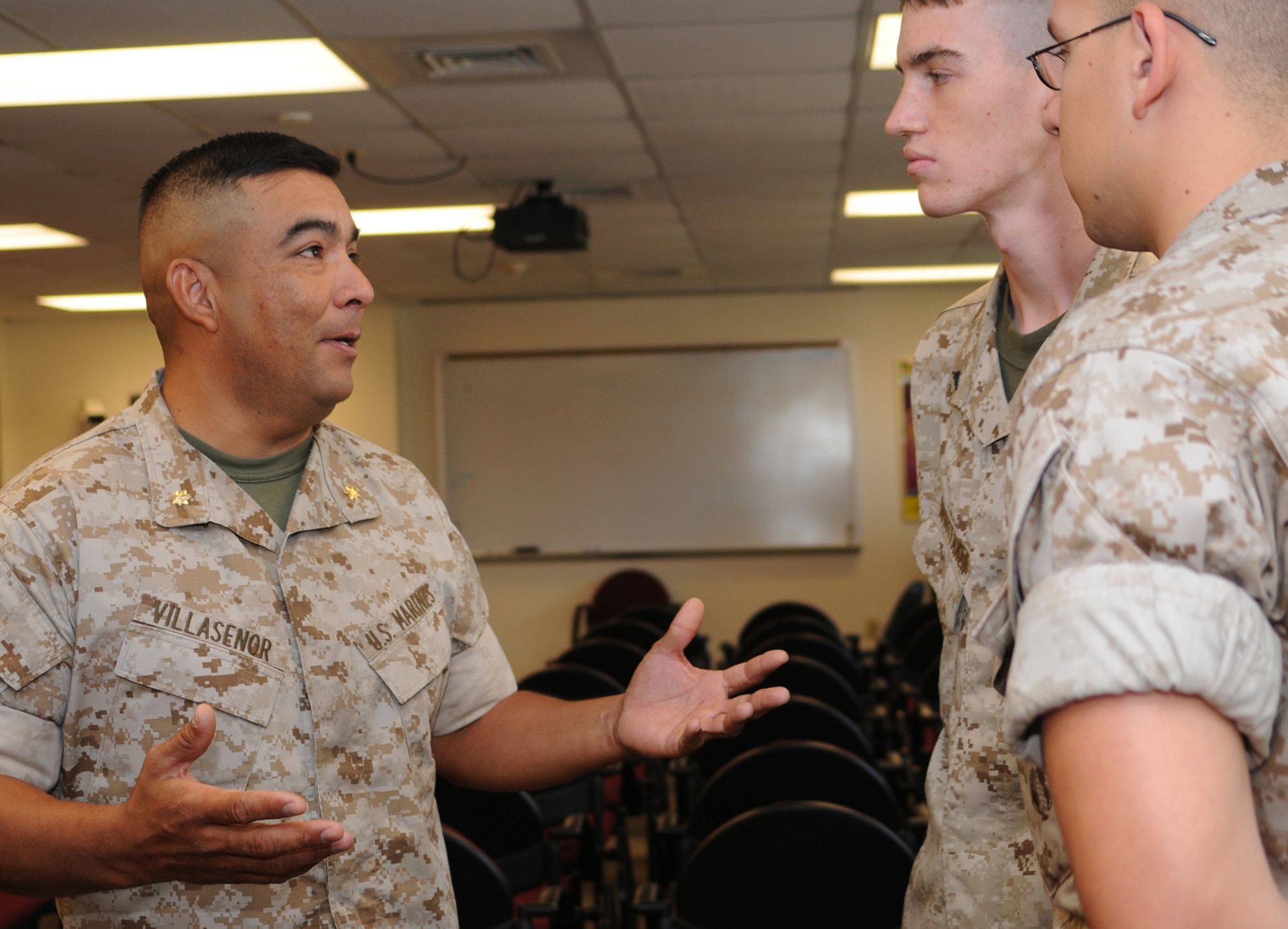 From left, Maj. Nieves Villasenor, new commander of Keesler’s Marine Corps Detachment, gets acquainted with Lance Cpl. Joshua Whittaker and Pfc. Thomas Nelson, students in the meteorology and oceanography course, June 19 inside the MARDET dormitory.  Major Villasenor, who came to Keesler from Camp Lejeune, N.C.,  took command of the unit June 13 from Maj. Byron King, who retired.  (U.S. Air Force photo by Kemberly Groue)