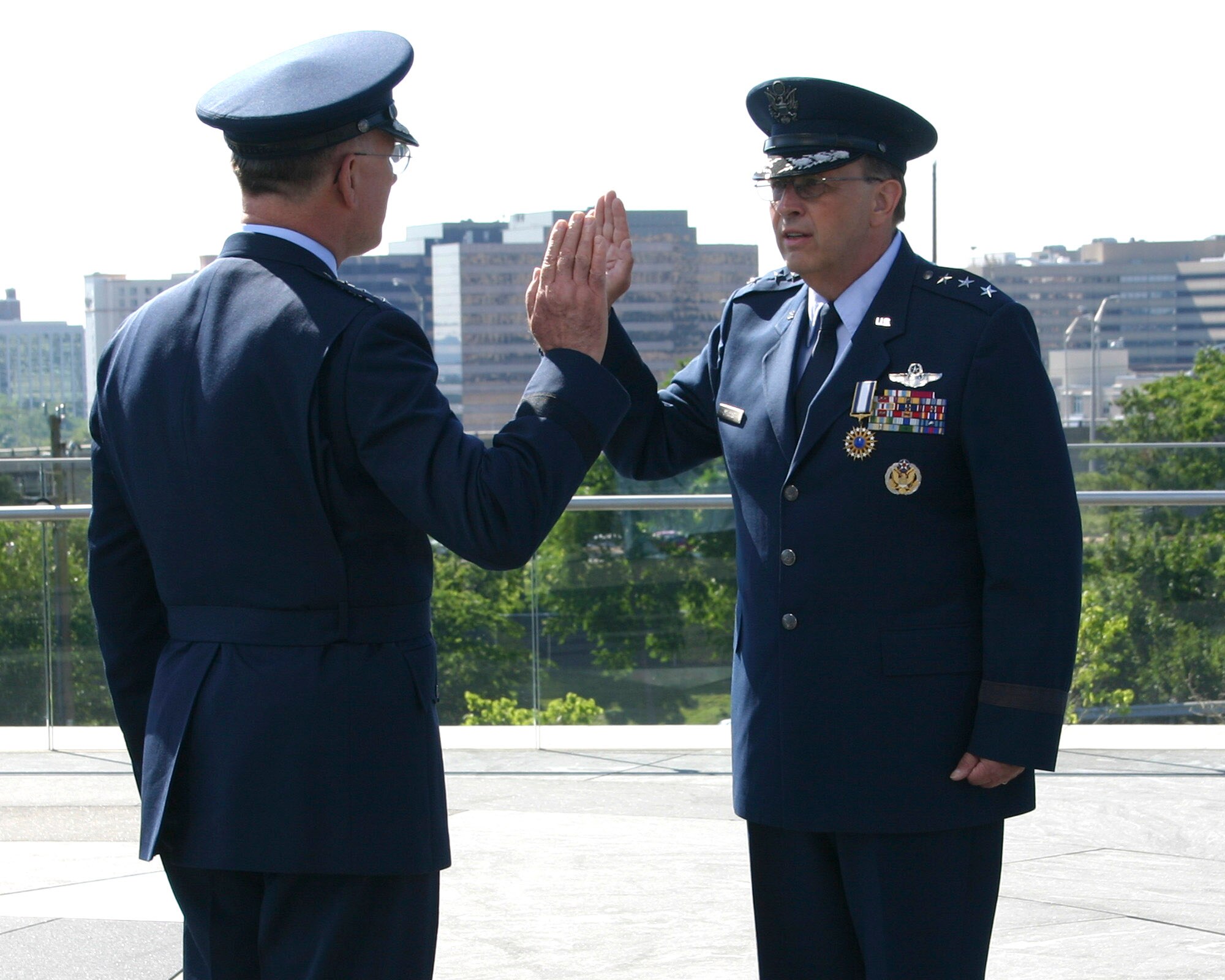Lt. Gen. John A. Bradley administers the oath of office to Lt. Gen. Charles E. Stenner Jr. during the change of command ceremony in which General Bradley relinquished command to General Stenner. The ceremony was at the Air Force Memorial in Arlington, Va., June 24. General Bradley is the chief of Air Force Reserve. (U.S. Air Force photo/Senior Master Sgt. Raymond Sarracino)