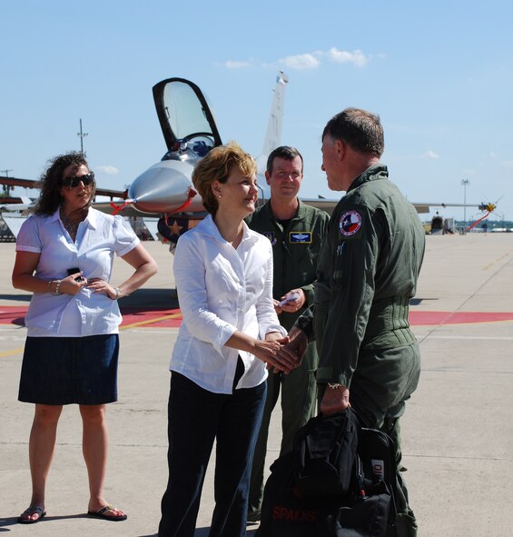 Lt Gen John "Coach" Bradley, Air Force Reserve Command commander, shares a moment with his wife, Jan Bradley, after his final F-16 flight at the Naval Air Station Fort Worth Joint Reserve Base Carswell Field, Texas. His daughter, Leigh Ann, (left) and Brig. Gen. Thomas Coon, 10th Air Force commander. wait to take the general to a large crowd of well-wishers. General Bradley completed his flying career Friday, June 20, 2008, logging in over 7053 total flight hours, many with the 457th Fighter Squadron Fighting Spads here. (U.S Air Force Photo/Tech. Sgt. Julie Briden-Garcia)
