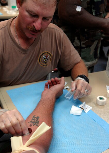 BARKSDALE AIR FORCE BASE, La. - A member of the Navy Mobile Construction Battalion 28 put the Combat Lifesaver skills they just learned to use June 20. The Seabees as they are more commonly called are participating in a four day long exercise to prepare the unit for deployment. (U.S. Air Force photo by Airman 1st Class Joanna M. Kresge)