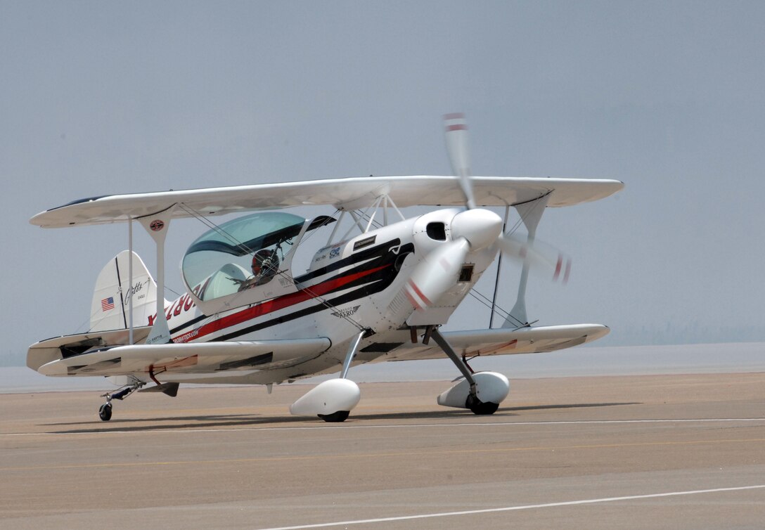 LANGLEY AIR FORCE BASE, Va. -- Ken Appezzato taxis  his biplane down the runway during Air Power over Hampton Roads here June 22.  Langley's open house is an annual event that helps educate the public, increase recruiting and show its appreciation to the local community. (U.S. Air  Force photo/Airman Rebecca Montez)