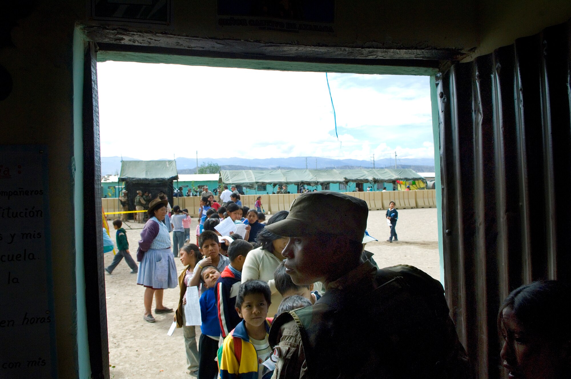 A Peruvian soldier guards a make-shift pharmacy June 22 during free medical evaluations for Peruvians living in the poorest regions of Ayacucho, Peru. American servicemembers are providing medical care during New Horizons-Peru 2008, a U.S. and Peruvian partnered humanitarian mission set on providing relief to underprivileged Peruvians. (U.S. Air Force photo/Staff Sgt. Bennie J. Davis III)