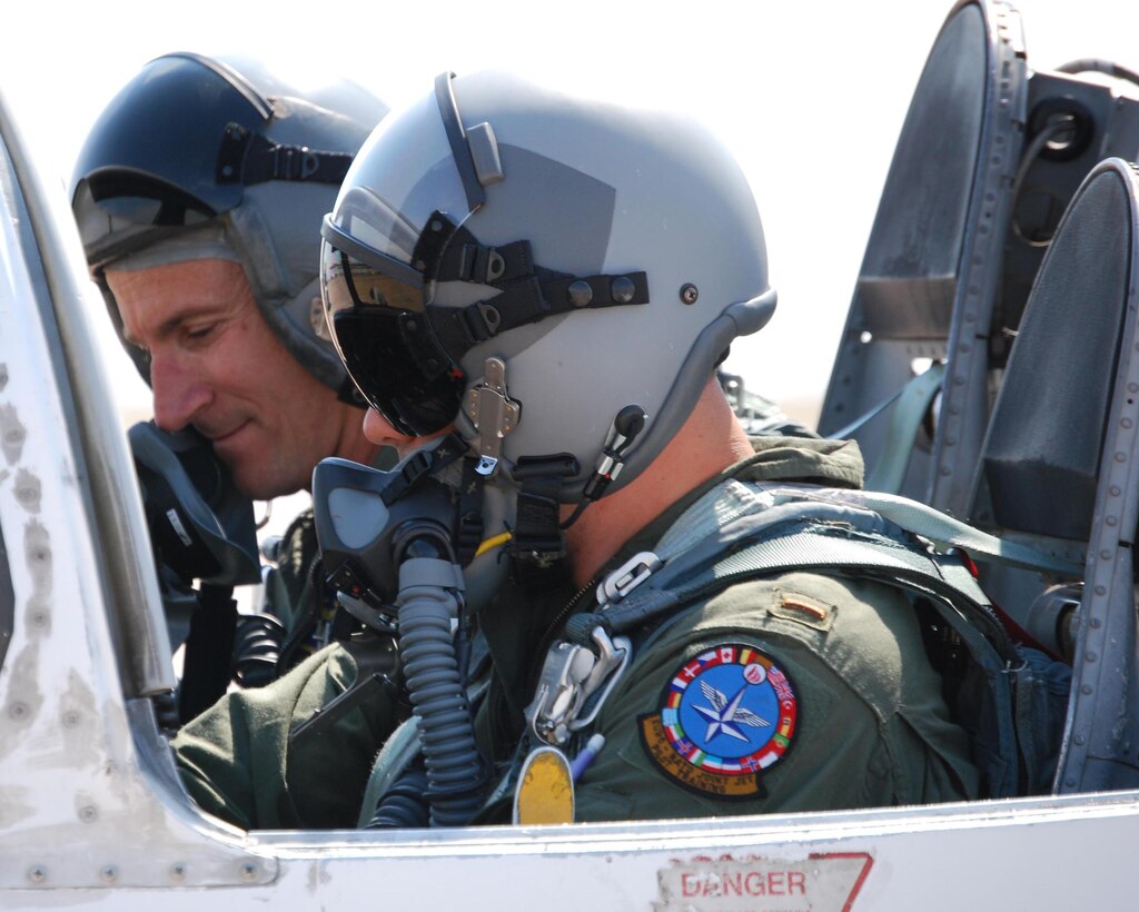 Lt. Col. Bo McGowan, left, commander of the 97th Flying Training Squadron at Sheppard Air Force Base, Texas, reached the fighter pilot milestone of 4,000 flying hours in one airframe when he landed June 24 in a T-37 Tweet. The colonel did it doing what he loves – training a future Air Force pilot. Also pictured is 2nd Lt. John Andre. (U.S. Air Force photo/John Ingle)