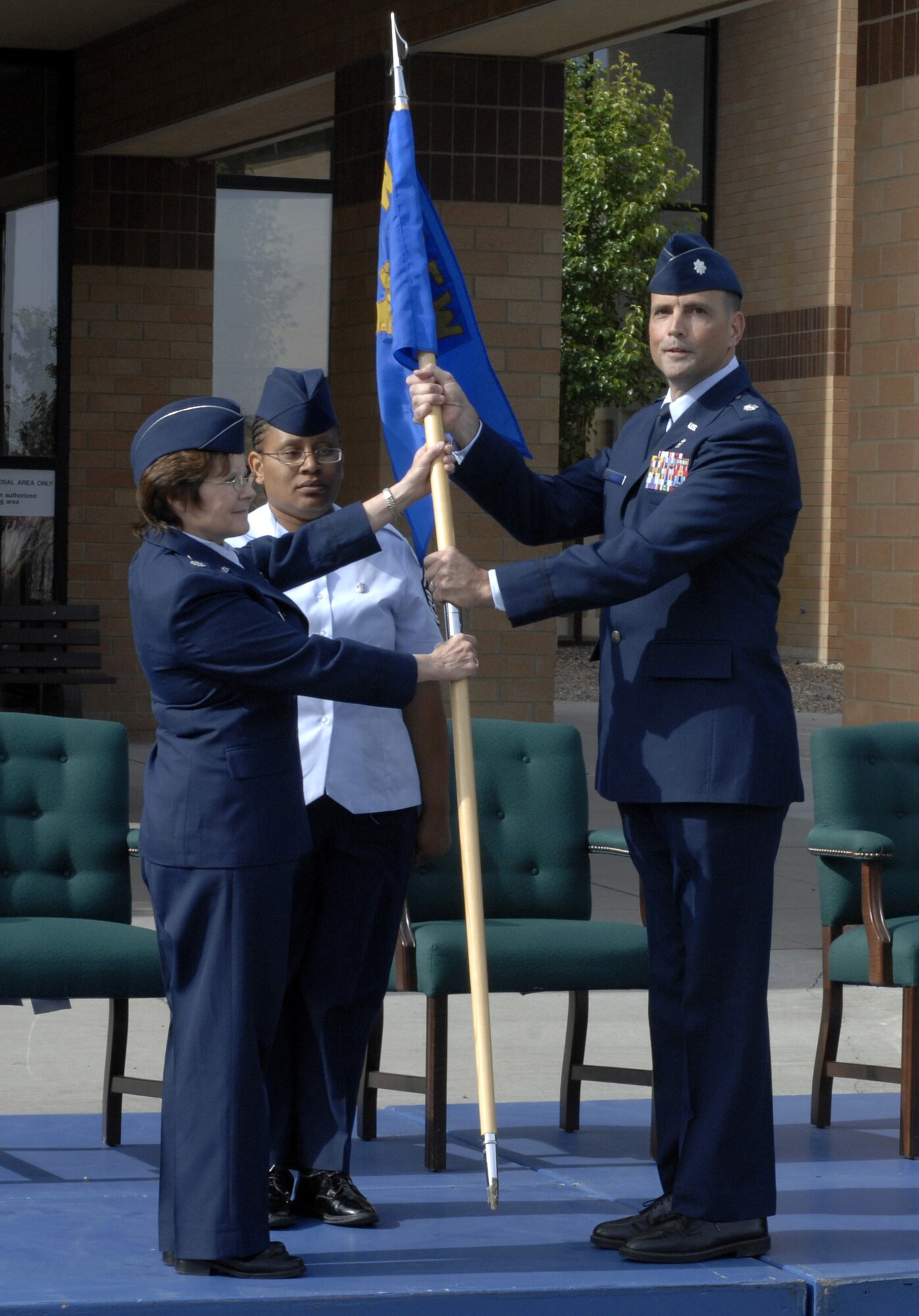 MOUNTAIN HOME AIR FORCE BASE, Idaho - Lt. Col. Pete Breed assumes command of the 366th Aeromedical Dental Squadron from Lt. Col. Bonnie Mack, 366th Medical Group acting deputy commander, in a change-of-command ceremony June 20 in front of the base hospital. (U.S. Air Force photo/ Airman 1st Class Ashley Winters) 