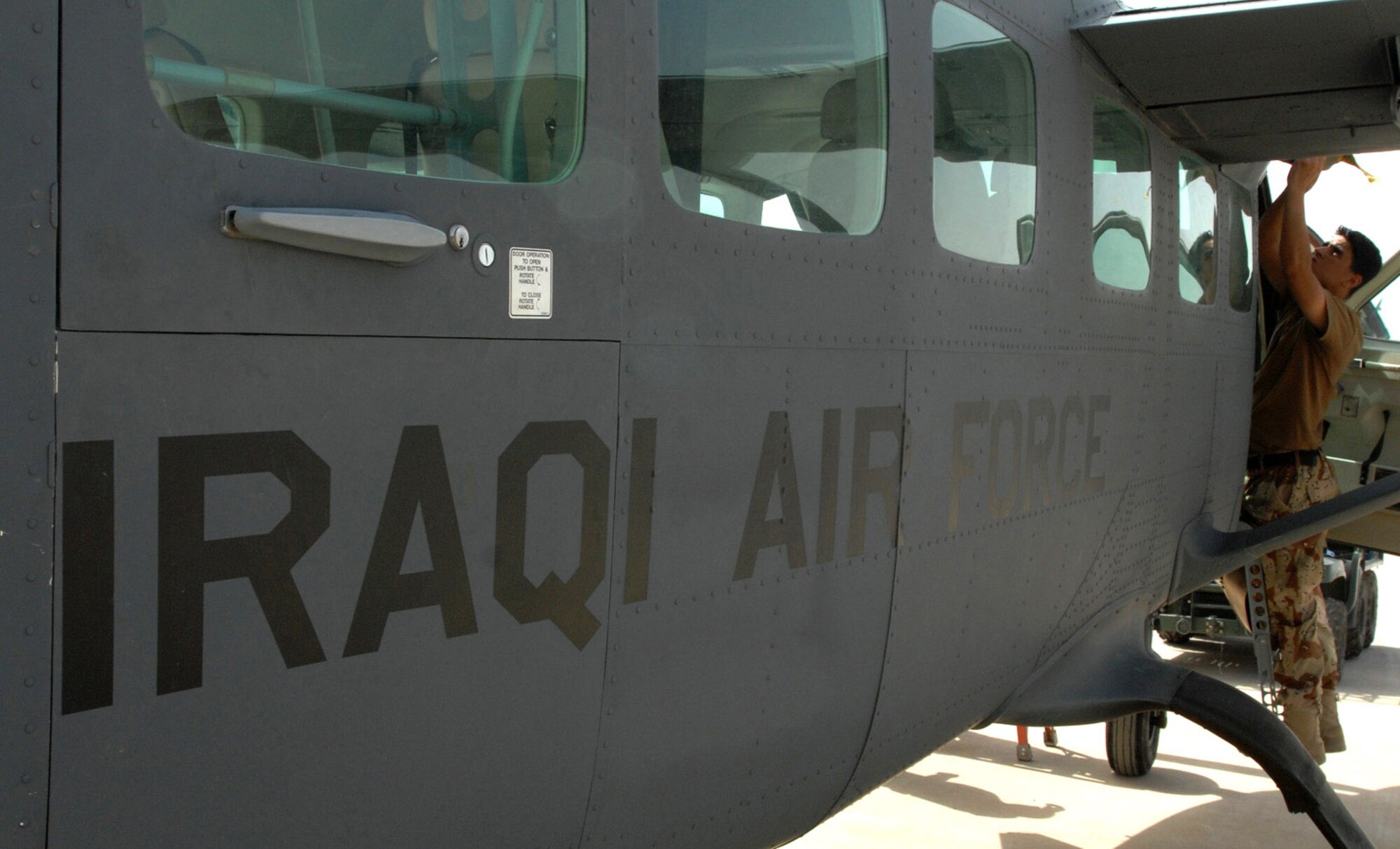 An Iraqi airman conducts maintenance on a Cessna June 7 at Kirkuk Air Base, Iraq. While Iraqi air force pilots continue flying sorties to aid stability in their nation, Iraqi maintainers on the ground have recently achieved important benchmarks to keep their fleet in the air. Airmen with the Iraqi air forces' 3rd Squadron took over a wide variety of maintenance duties on the unit's Cessna intelligence, surveillance and reconnaissance fleet, a task formerly performed by U.S. contractors. (U.S. Air Force photo/Senior Airman Eric Schloeffel) 