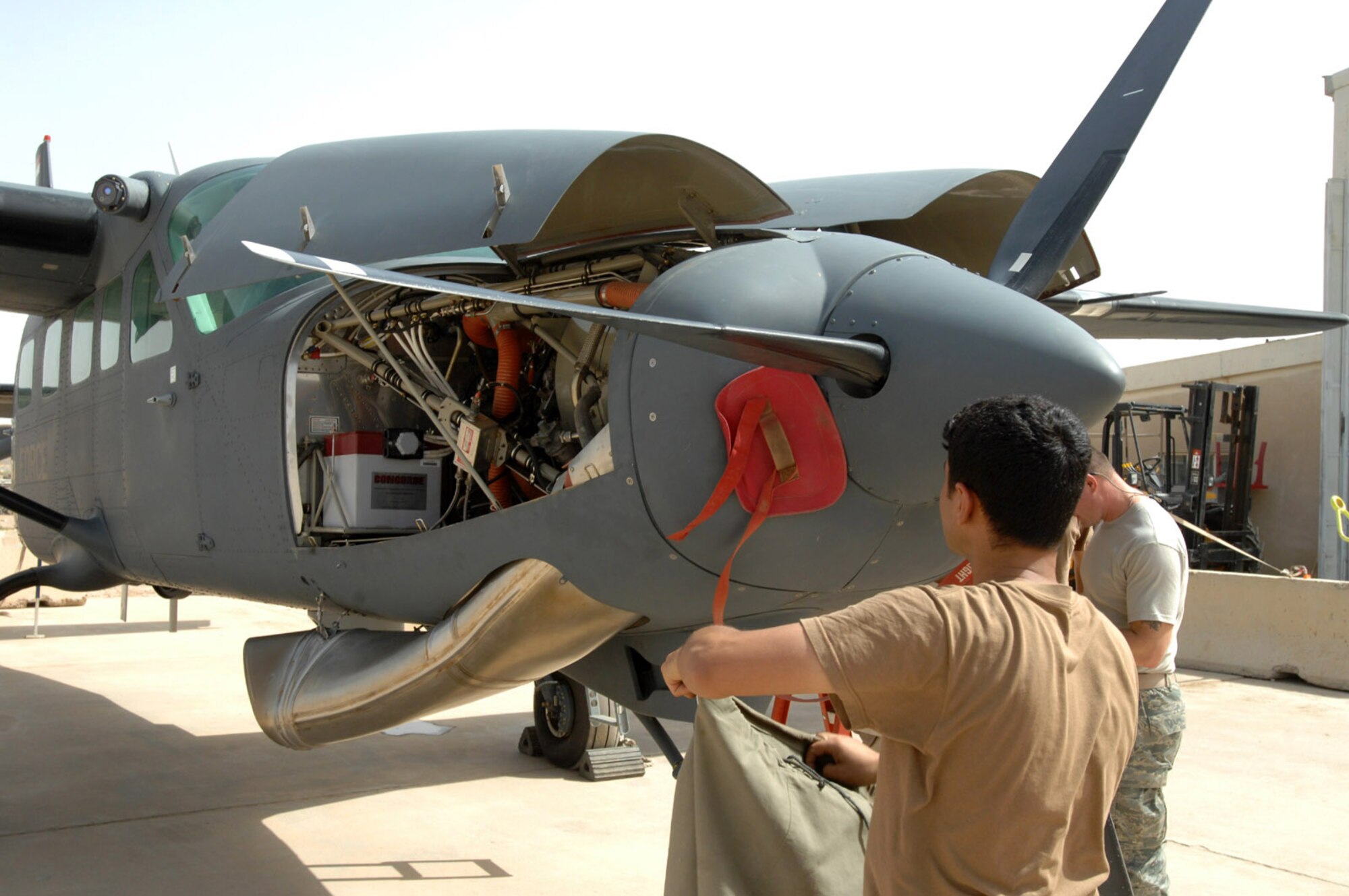 An Iraqi airman conducts maintenance on a Cessna June 7 at Kirkuk Air Base, Iraq. While Iraqi air force pilots continue flying sorties to aid stability in their nation, Iraqi maintainers on the ground have recently achieved important benchmarks to keep their fleet in the air. Airmen with the Iraqi air forces' 3rd Squadron took over a wide variety of maintenance duties on the unit's Cessna intelligence, surveillance and reconnaissance fleet, a task formerly performed by U.S. contractors. (U.S. Air Force photo/Senior Airman Eric Schloeffel) 