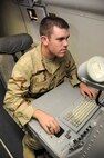 Air Force Academy Cadet Shawn Rousseau familiarizes himself with a workstation aboard a RC-135V/W Rivet Joint reconnaissance aircraft June 19 in Southwest Asia. The cadets are visiting the base as part of the academy's Operation Air Force program, allowing them to experience an active-duty deployment. Cadet Rousseau graduates from the Air Force Academy in May 2009 and hopes to be an A-10 Thunderbolt II pilot. (U.S. Air Force photo/Senior Airman Domonique Simmons) 