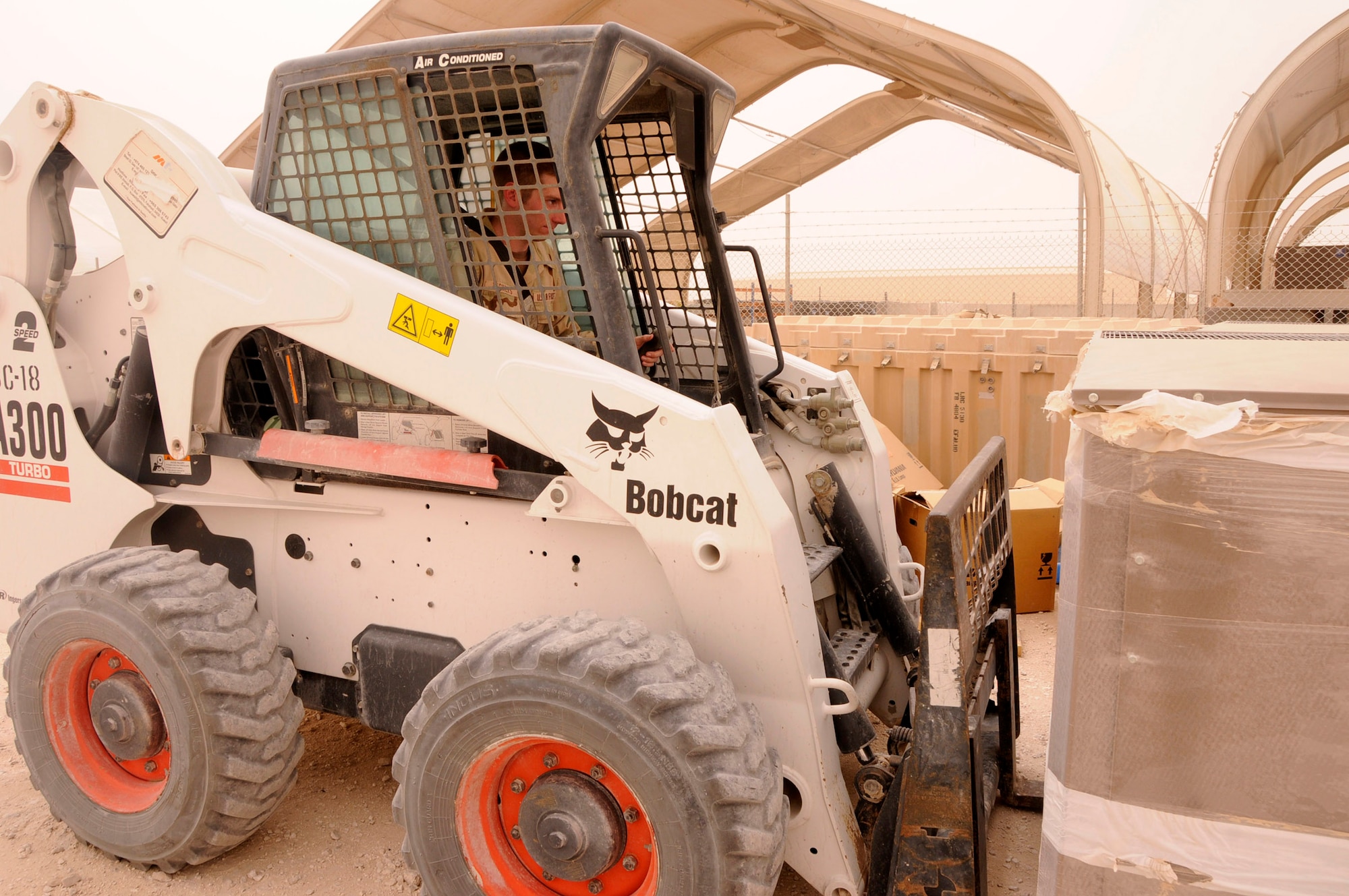 Air Force Academy Cadet Brian Vickers lifts a pallet as part of his on-the-job training June 19 at a base in Southwest Asia. The cadets are visiting the base as part of the academy's Operation Air Force program, allowing them to experience an active-duty deployment. The visit includes experiencing many areas of the civil engineer squadron to learn more about the labor that keeps the squadron moving. (U.S. Air Force photo/Senior Airman Domonique Simmons)