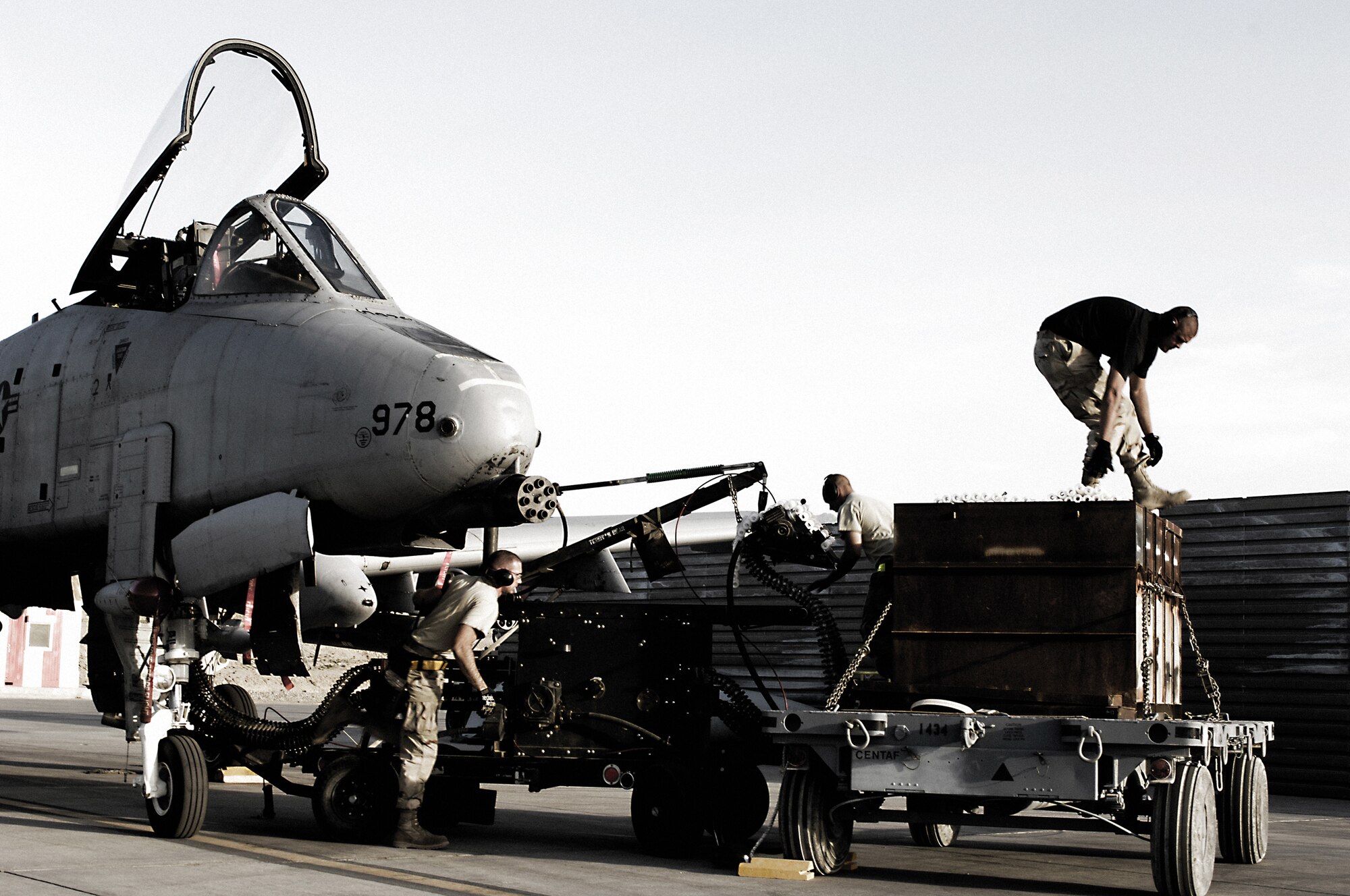 Members of the 455th Expeditionary Aircraft Maintenance Squadron load foot-long 30 mm ammunition on an A-10 Thunderbolt II before a combat mission. The "hog"s' GAU-8/A seven-barrel Gatling gun is the business end of the Air Force's premier ground-attack fighter, which has been in the Air Force inventory since October 1975. (U.S. Air Force photo by Master Sgt. Demetrius Lester)