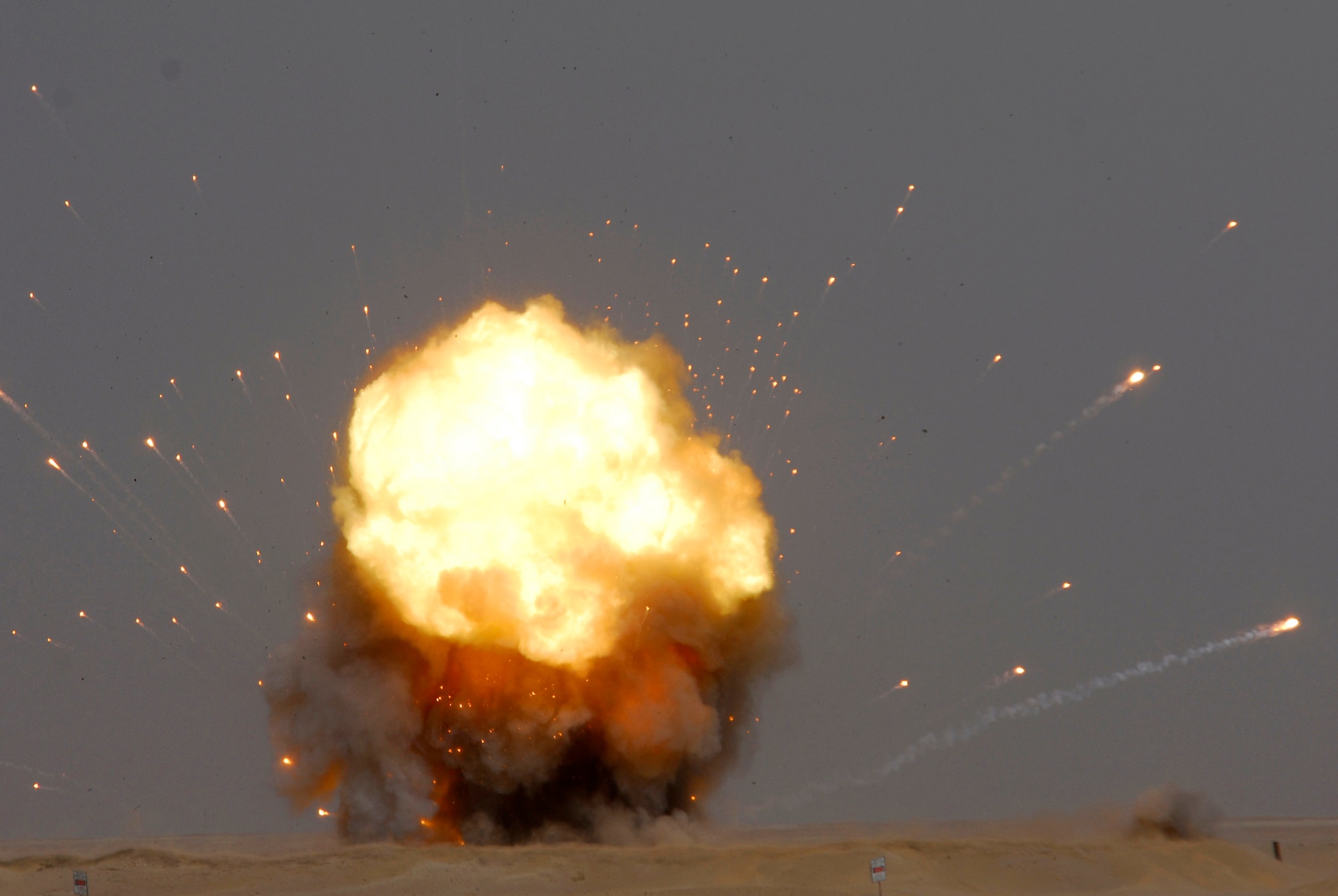 A fireball rises into the sky during a controlled detonation performed by coalition forces from the Air Force's 386th Expeditionary Civil Engineer Squadron and the Australian army June 20 at an explosive ordnance disposal range in Southwest Asia. The joint detonation also provided an opportunity for the U.S. and coalition forces to enhance their relations while learning some of the slight differences in operating procedures. (U.S. Air Force photo/Staff Sgt. Patrick Dixon) 