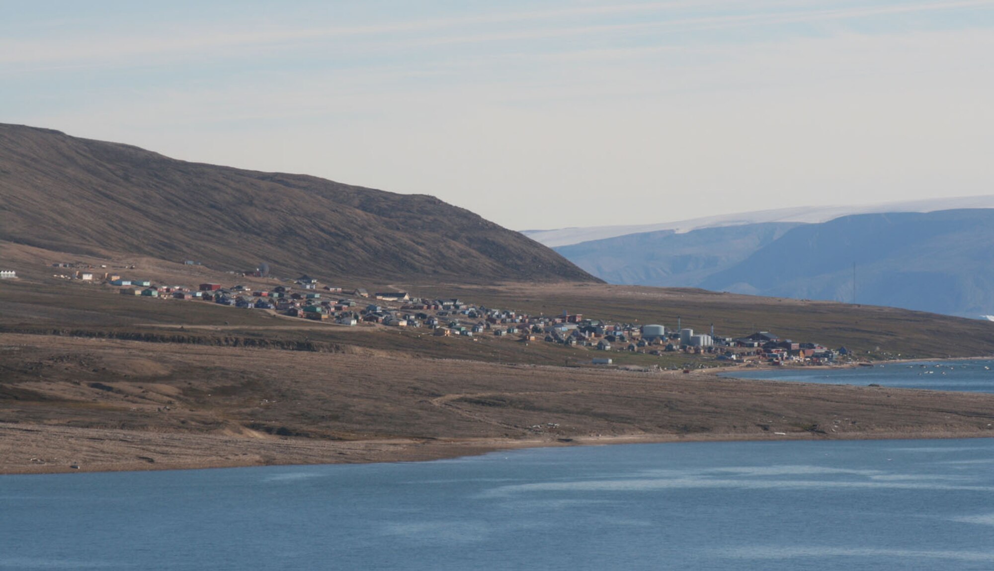 Located approximately 65 miles north of Thule Air Base, Greenland, the village of Qaanaaq is home to about 600 people. This photo taken in late summer 2007 after the ice on the surrounding water had melted. (U.S. Air Force photo/Col. Lee-Volker Cox)