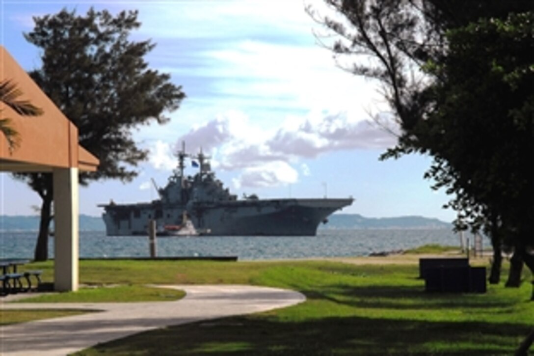 The U.S. Navy amphibious assault ship USS Essex is guided by a tugboat onto White Beach Naval Facility in Okinawa to offload the 31st Marine Expeditionary Unit after a successful spring patrol, Okinawa, Japan, June 20, 2008. The Essex is the lead ship of the only forward-deployed U.S. Expeditionary Strike Group and serves as the flagship for CTF 76, the Navy's only forward deployed amphibious force commander. 