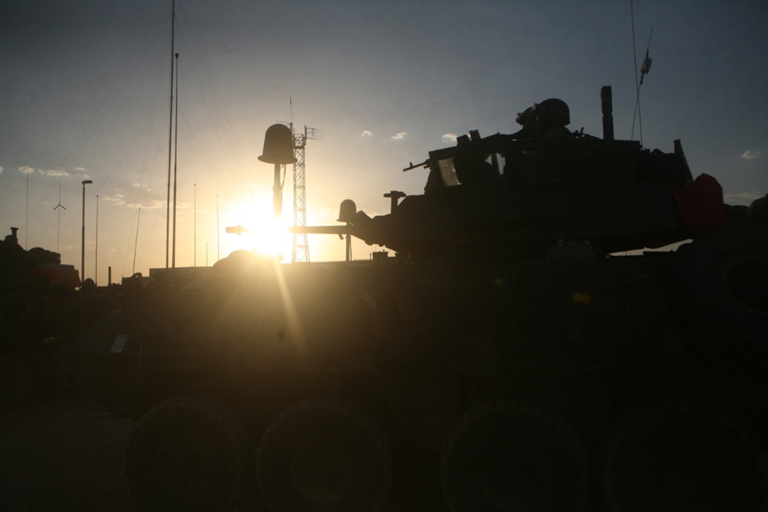 Marines with Alpha Company, 2nd Light Armored Reconnaissance Battalion, Regimental Combat Team 5 arrive back to Camp Korean Village, Iraq, June 23, after an initial meeting with local leaders in the town of Nukhayb. During the mission, Marines with Alpha Co. and members of SEAL Team 3, visited the mayor of the town, Sheik Lawrence Mutib Hazan, and discussed ways to better the town and living conditions for the people. ::r::::n::