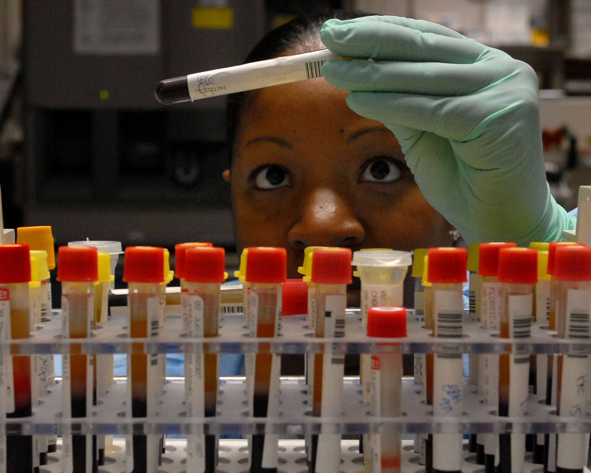 YOKOTA AIR BASE, Japan -- Technical Sergeant Symone Linthicome from the 374th Medical Group, logs in blood samples from taht days patients. Logging in the samples help keeps track of patient information to insure proper testing is completed. (U.S. Air Force photo by Senior Airman Laszlo Babocsi)