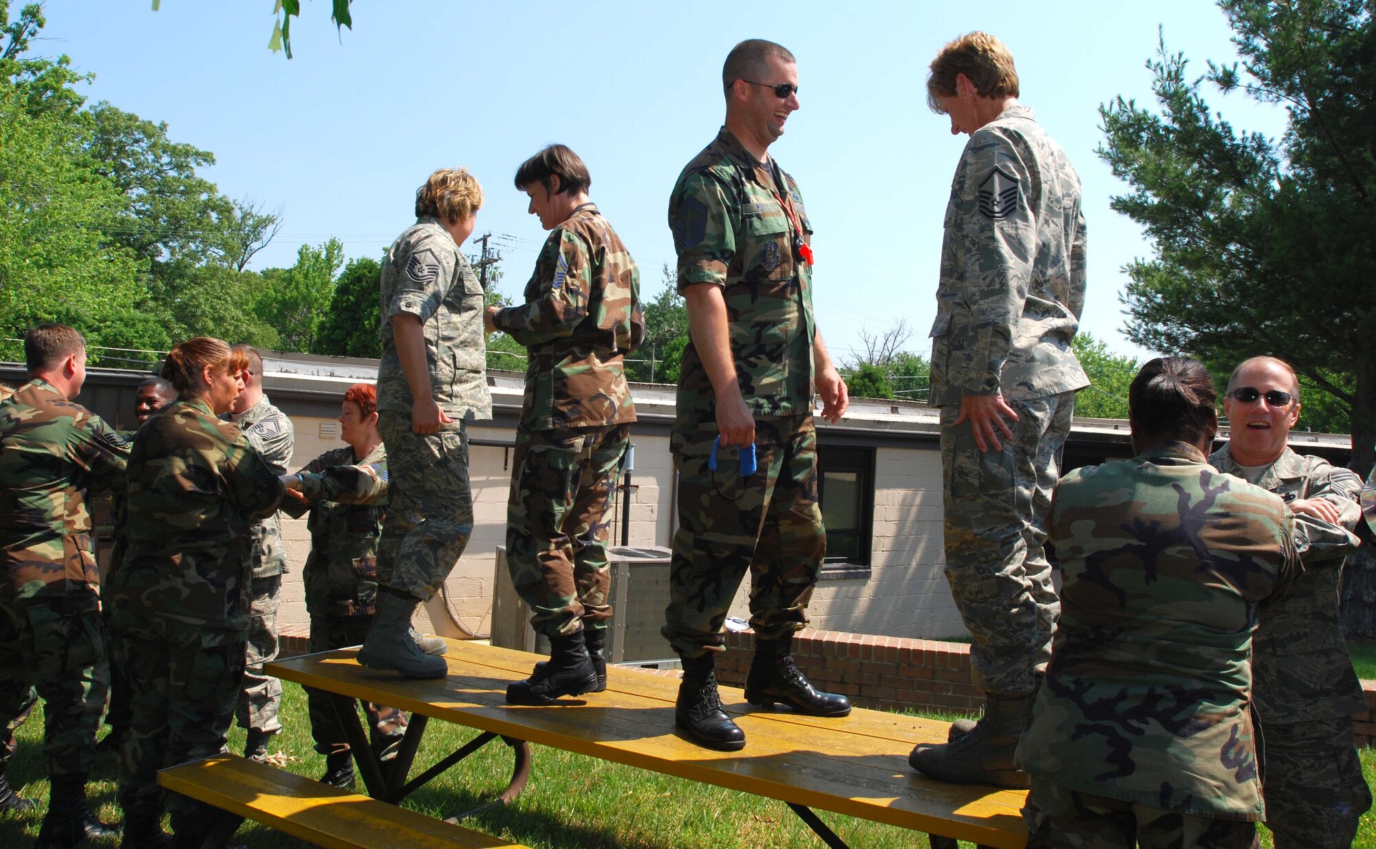 ANDREWS AIR FORCE BASE, Md. -- Facilitators stand ready to release students from blindfolded freefalls into the arms of their fellow classmates during the Air Force Reserve Command Senior Non-Commissioned Officer Leadership Course here June 21. The interactive two-day course consisted of group discussions, trust exercises, and techniques to enhance communication with commanders and subordinates. (U.S. Air Force photo/Tech. Sgt. Amaani Lyle)
