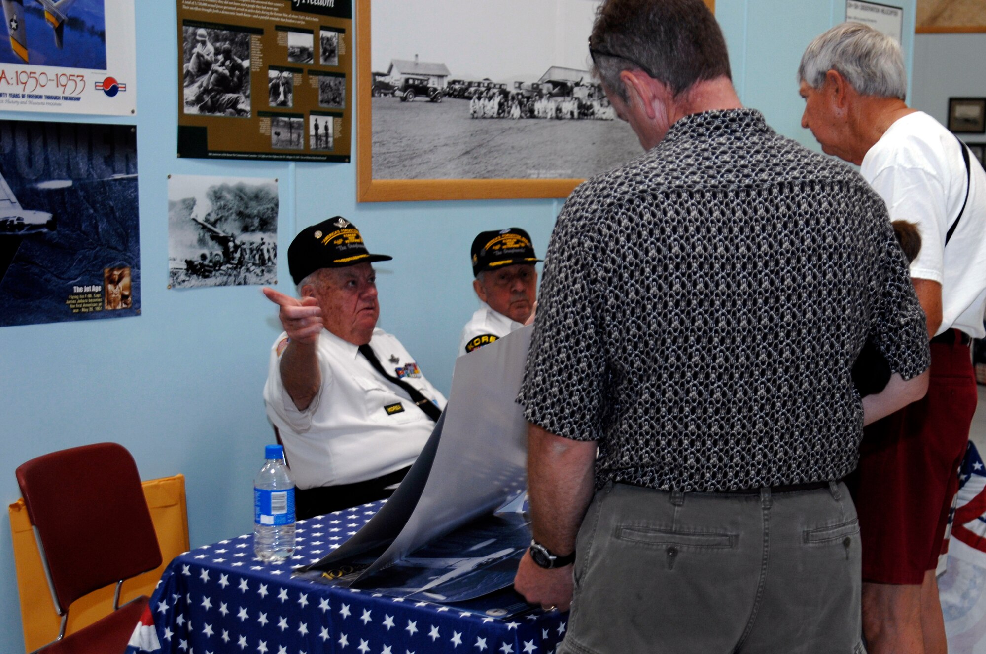 Korean War Veterans, retired Lt. Col. Jerry Teachout and retired Army Master Sgt. Robert Hempel educate visitors of the South Dakota Air and Space Museum of their experiences during the conflict June 25. The display commemorated the 58th anniversary of the beginning of hostilities in Korea.  (U.S. Air Force photo/Airman Matthew Flynn)