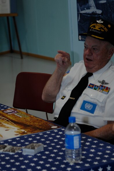Retired Air Force Lt. Col. Jerry Teachout talks about his experiences during the Korean War at a special display held at the South Dakota Air and Space Museum June 25.  Colonel Teachout attended the display to commemorate the 58th anniversary of the beginning hostilities in Korea. (U.S. Air Force photo/Airman Matthew Flynn)