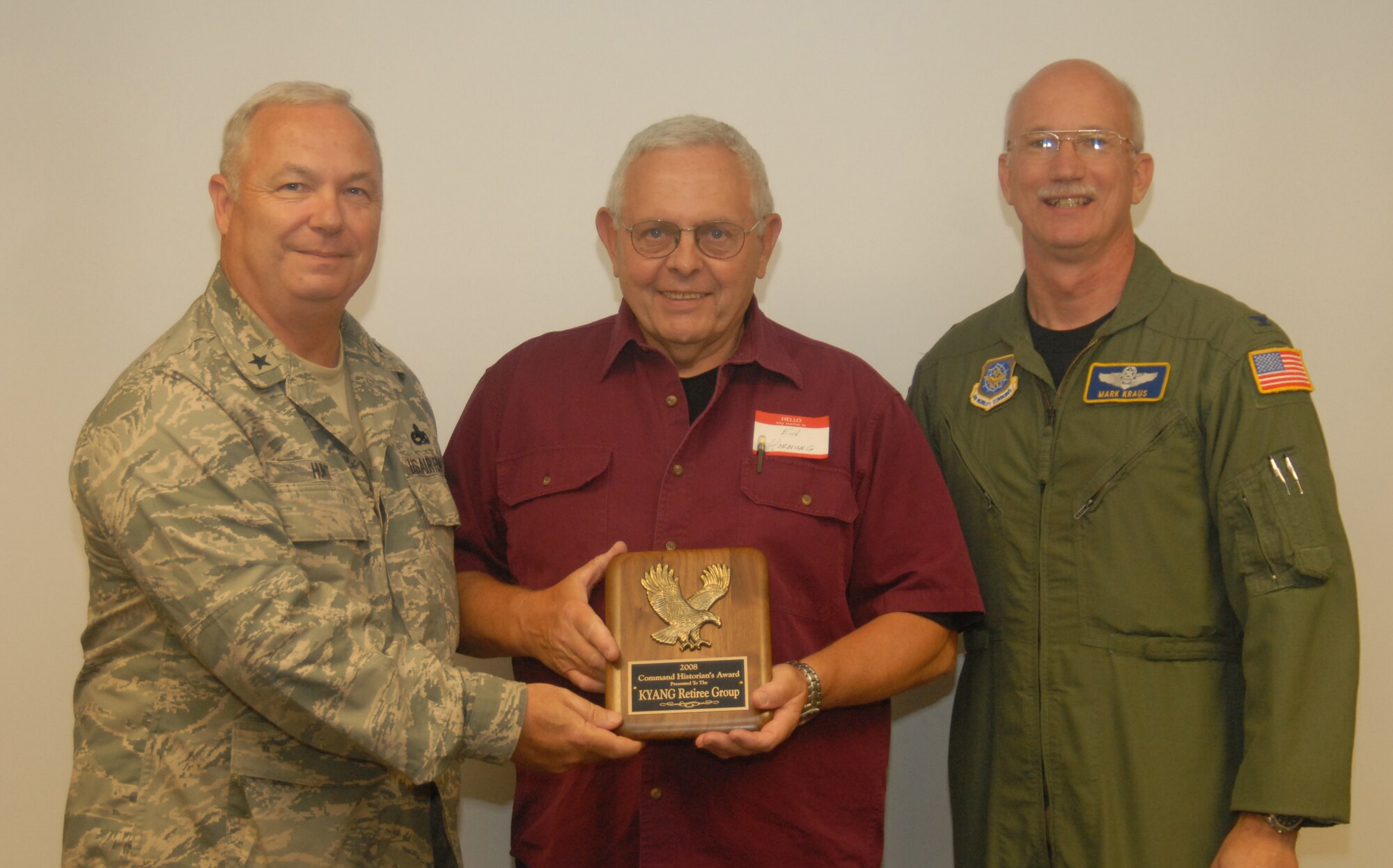 Col. (ret) Ed Hornung accepts the Historian’s plaque on behalf of the KYANG Retiree Group, presented by Brig. Gen. Howard P. Hunt, III, Kentucky Air National Guard Assistant Adjutant General, and Col. Mark R. Kraus, 123rd Airlift Wing Commander - photo by Tech. Sgt. Philip S. Speck