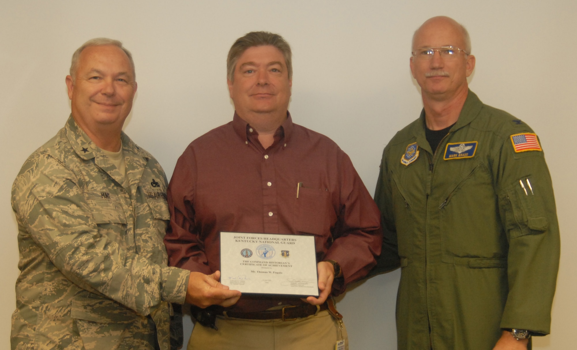 Mr. Thomas W. Fugate receives the Historian’s Certificate of Achievement, presented by Brig. Gen. Howard P. Hunt, III, Kentucky Air National Guard Assistant Adjutant General, and Col. Mark R. Kraus, 123rd Airlift Wing Commander - photo by Tech. Sgt. Philip S. Speck