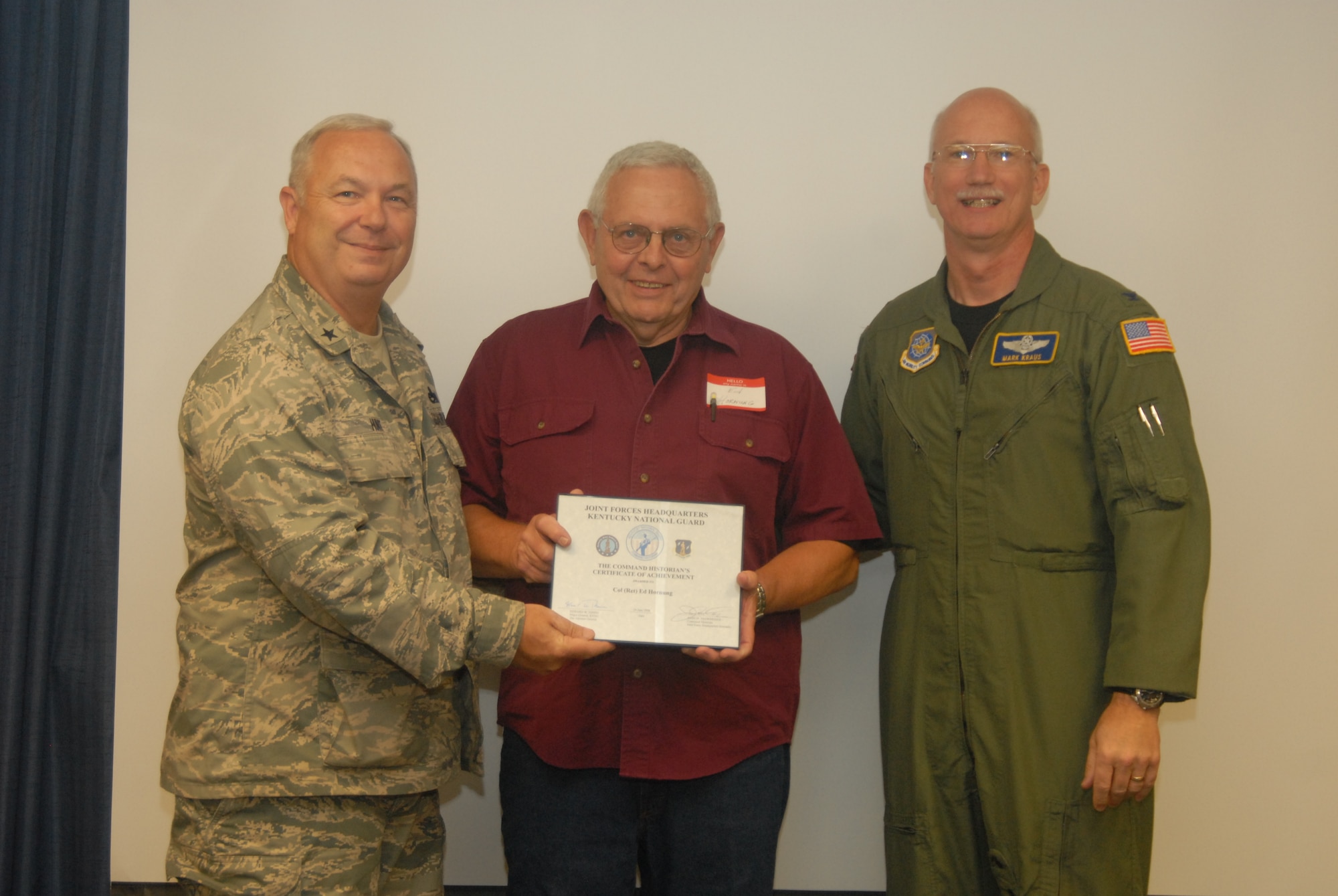 Col. (ret) Ed Hornung receives the Historian’s Certificate of Achievement, presented by Brig. Gen. Howard P. Hunt, III, Kentucky Air National Guard Assistant Adjutant General, and Col. Mark R. Kraus, 123rd Airlift Wing Commander - photo by Tech. Sgt. Philip S. Speck