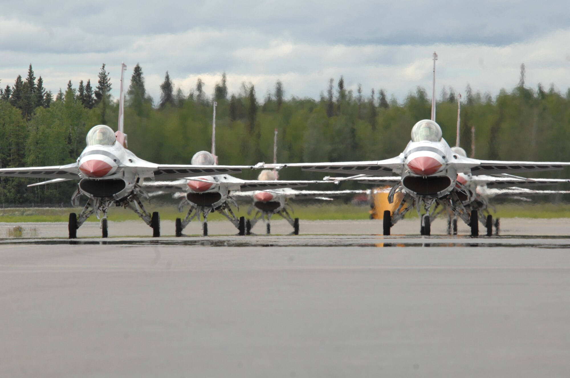 The U.S. Air Force Thunderbirds flight demonstration team taxi onto the flightline during the 2008 "Soaring into Solstice" Thunderbirds Show at Eielson Air Force Base, Alaska, June 24.  The Thunderbirds are assigned to the U.S. Air Force Air Demonstration Squadron at Nellis AFB, Nev.  (U.S. Air Force photo/Staff Sgt. Tia Schroeder)