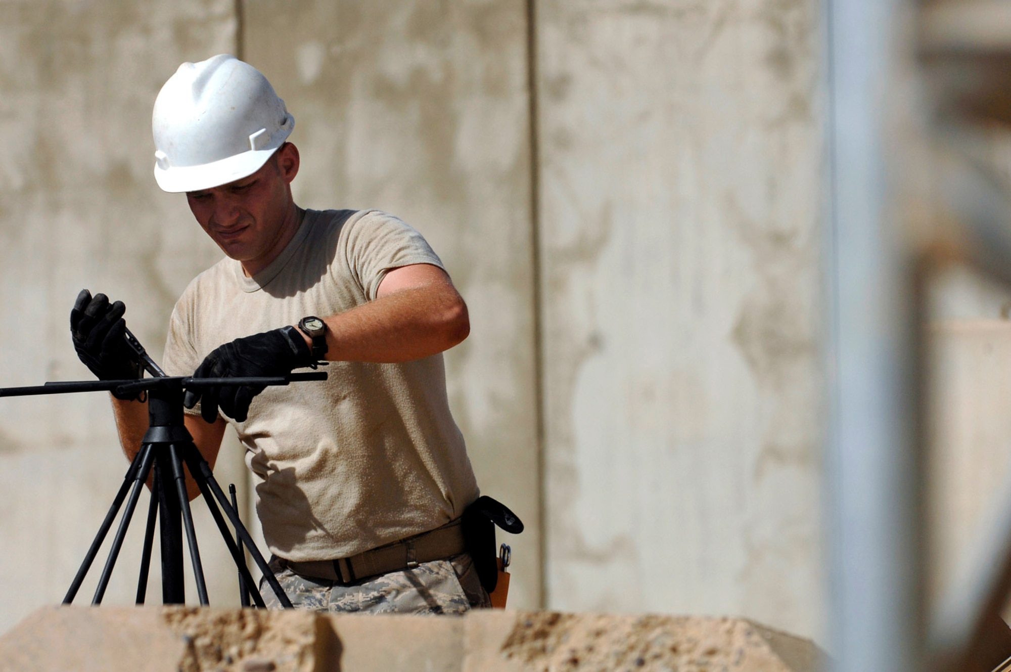Senior Airman Michael Lee pieces together a high-frequency radio used for line-of-sight tactical radio communications June 21 at Joint Base Balad, Iraq. The radio and new high-frequency antenna directly support ground operations for warfighters in Iraq. Airman Lee is a 332nd Expeditionary Communications Squadron ground radio maintainer deployed from Lajes Field, Azores. (U.S. Air Force photo/Senior Airman Julianne Showalter)