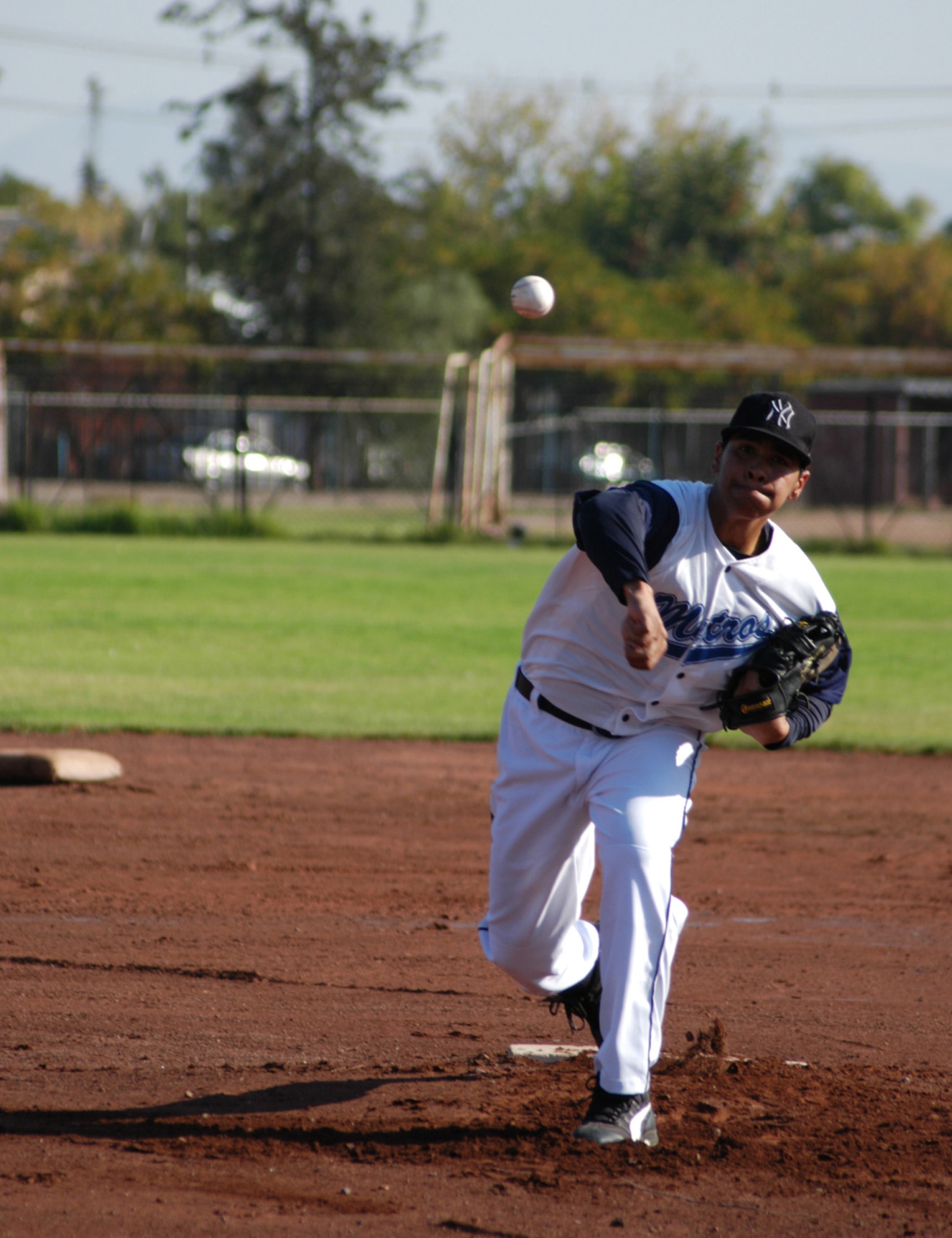 The pitcher for the Santiago, Chile Metros fires one across the plate. This squad of semi-pros age 19 and under played a friendly match with U.S. Air Force Airmen participating in FIDAE 2008, one of the largest combined air and trade shows, and  Exercise Newen 2008. The exercise builds the partnership between the U.S. and Chilean militaries. The Colorado Rockies professional baseball team donated items brought by the Airmen to the children of Santiago.(U.S. Air Force photo/Master Sgt. Jason Tudor)                                                                 