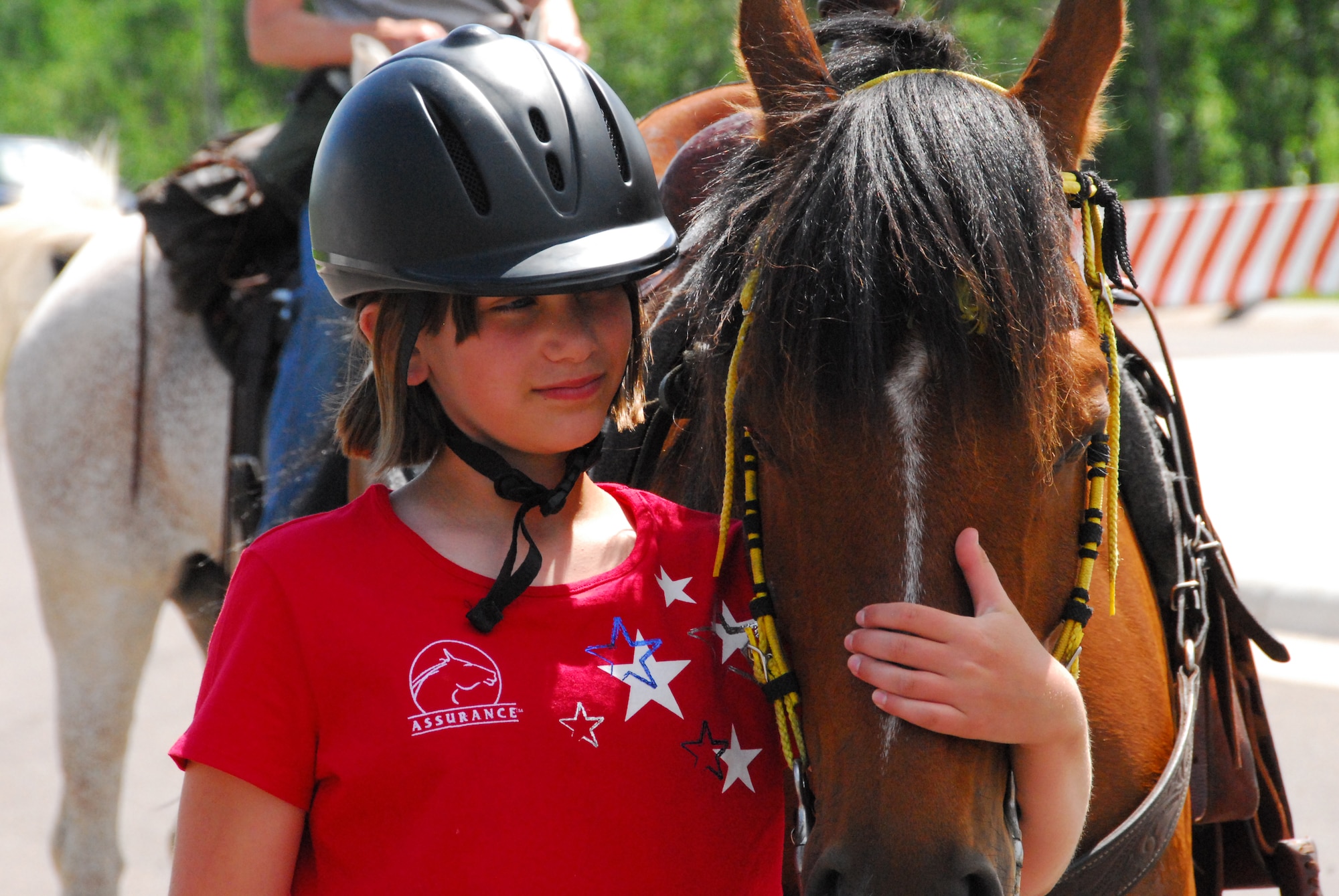 E'leese Madgett Manrique, 12 years old, stops at the 148th Fighter Wing, Duluth, Minn. to meet with wing members on June 23, 2008.  E'leese is riding her horse across Minn. trying to raise $15 million to start a ranch for veterans and military members.  (U.S. Air Force photo by Tech. Sgt. Jason W. Rolfe)  (Released)