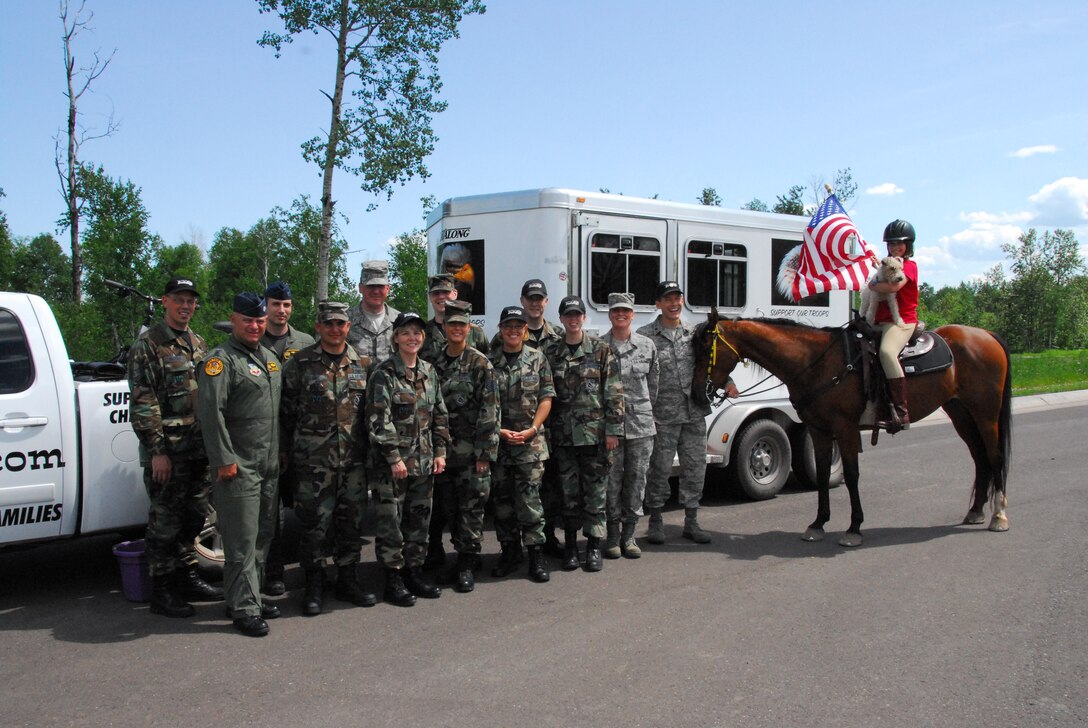 E'leese Madgett Manrique, 12 years old, stops at the 148th Fighter Wing, Duluth, Minn. to meet with wing members on June 23, 2008.  E'leese is riding her horse across Minn. trying to raise $15 million to start a ranch for veterans and military members.  (U.S. Air Force photo by Tech. Sgt. Jason W. Rolfe)  (Released)