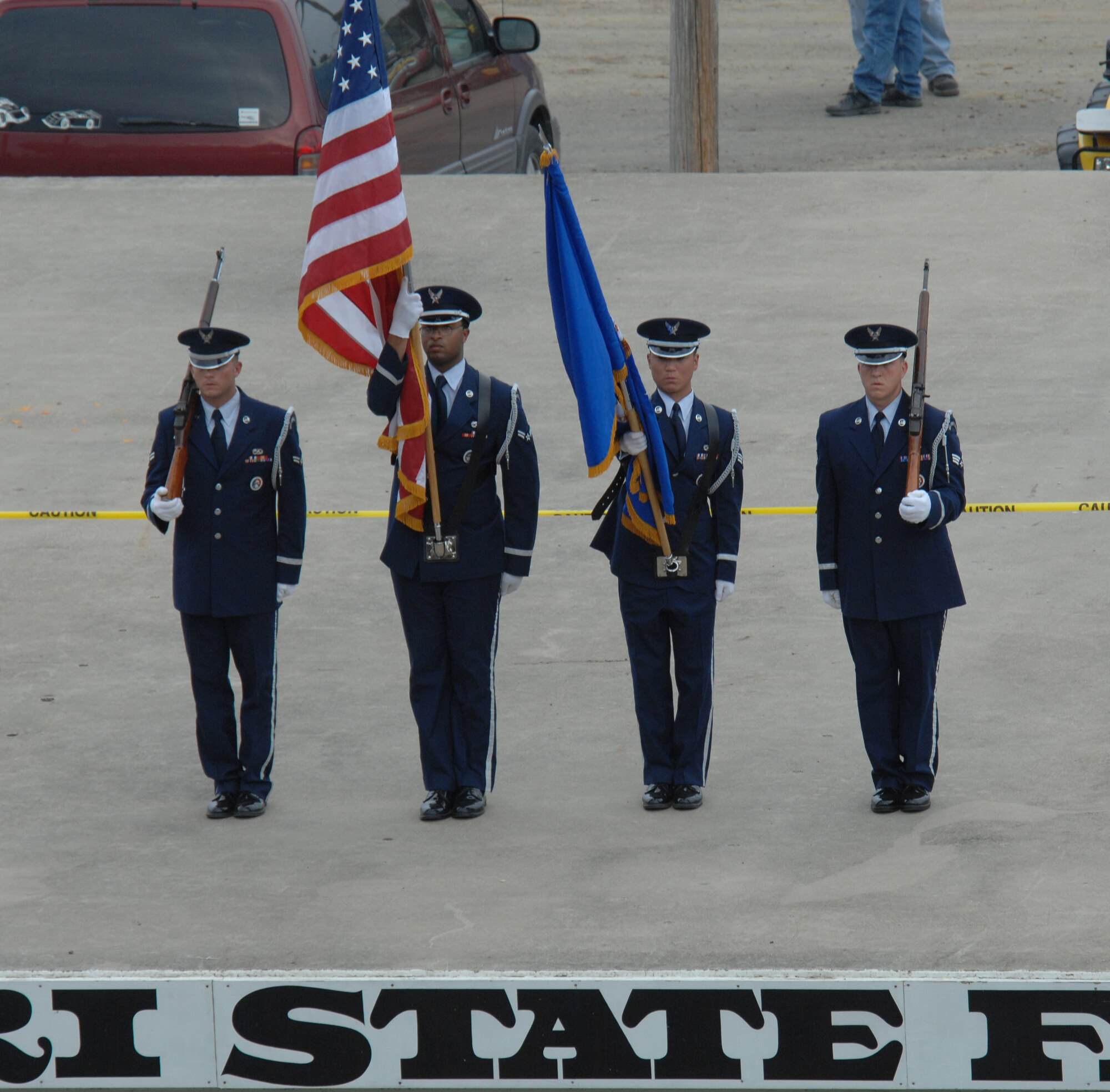 SEDALIA, Mo. – Members of the Whiteman Honor Guard come to a halt in front of center stage before presenting the colors at the at the U.M.P. DIRTcar Summer Nationals event #11 at Sedalia State Fair Speedway June 24. Two teams of 22 Whiteman Honor Guardmens from various Air Force Specialty Codes represent the Air Force in a variety of military and civilian ceremonies conducted throughout Missouri and Kansas. (U.S. Air Force photo/Tech. Sgt. Walt Farwell)