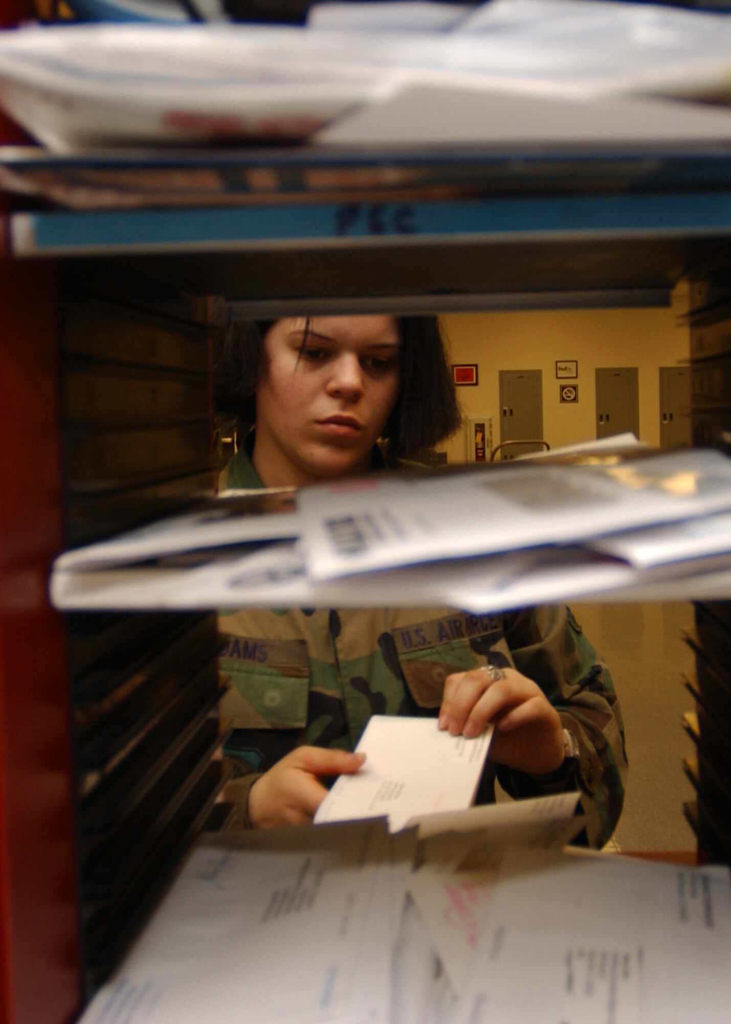 SCOTT AIR FORCE BASE, Ill. -- Airman 1st Class Zoe Adams quality-checks mail to ensure it is sorted for delivery to the proper destination.                                                           
(US Air Force photo/Master Sgt. Brian Davidson)