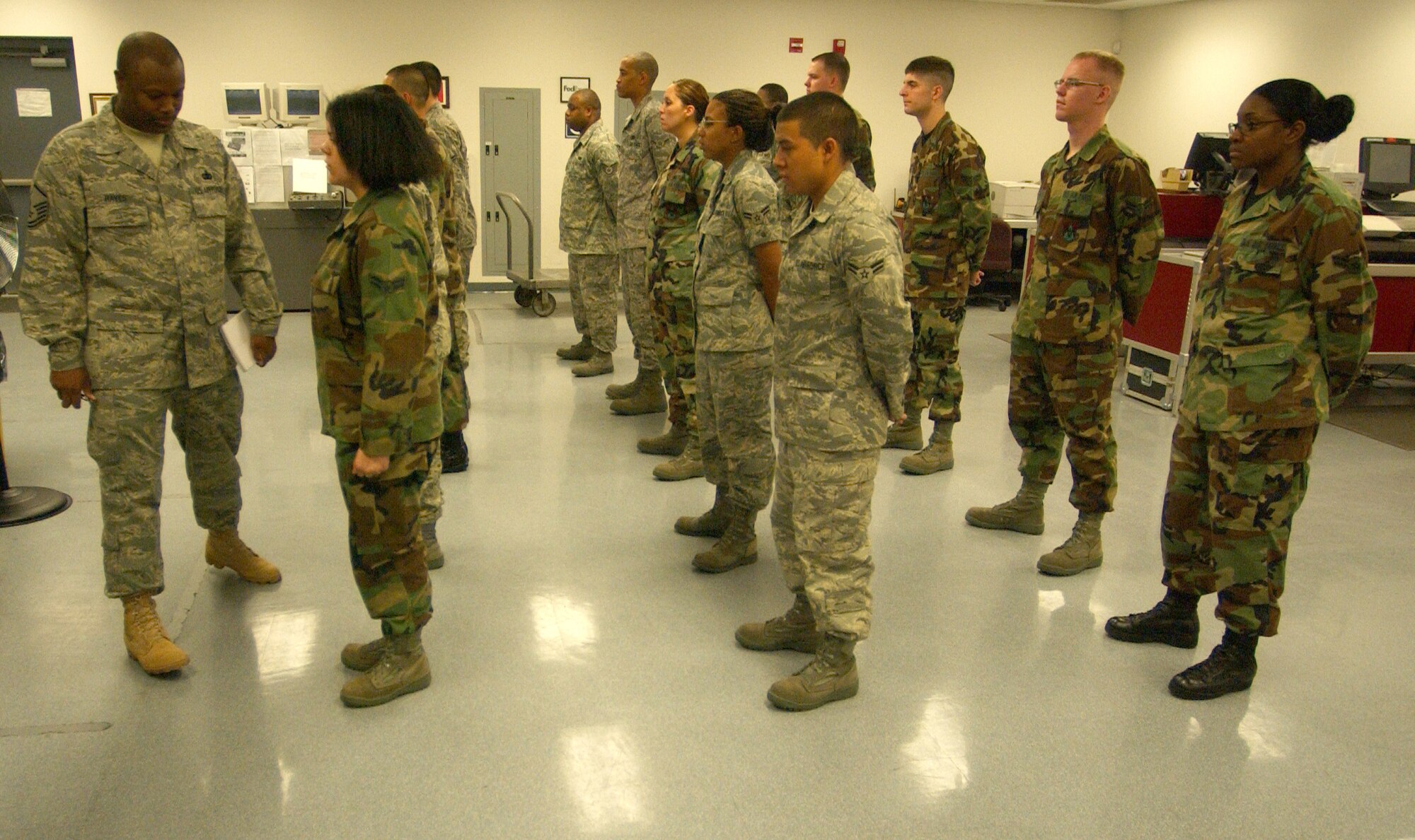 SCOTT AIR FORCE BASE, Ill. -- Master Sgt. Jerome Hayes, Electronic Communication Flight NCO in charge, performs an open ranks inspection at the Official Mail Center prior to the start of the duty day.                                                                                           
(US Air Force photo/Master Sgt. Brian Davidson)