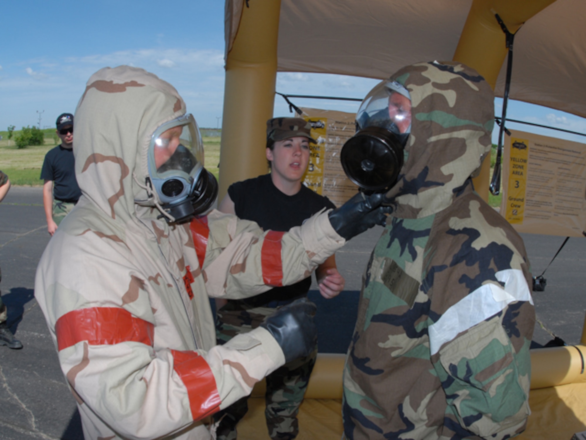 Airmen go through a decontamination line at the 119th Wing, N.D. Air National Guard during Emergency Management Training in Fargo on Monday, June 23, 2008.

Photo taken by SMSgt David Lipp, 119th Wing.