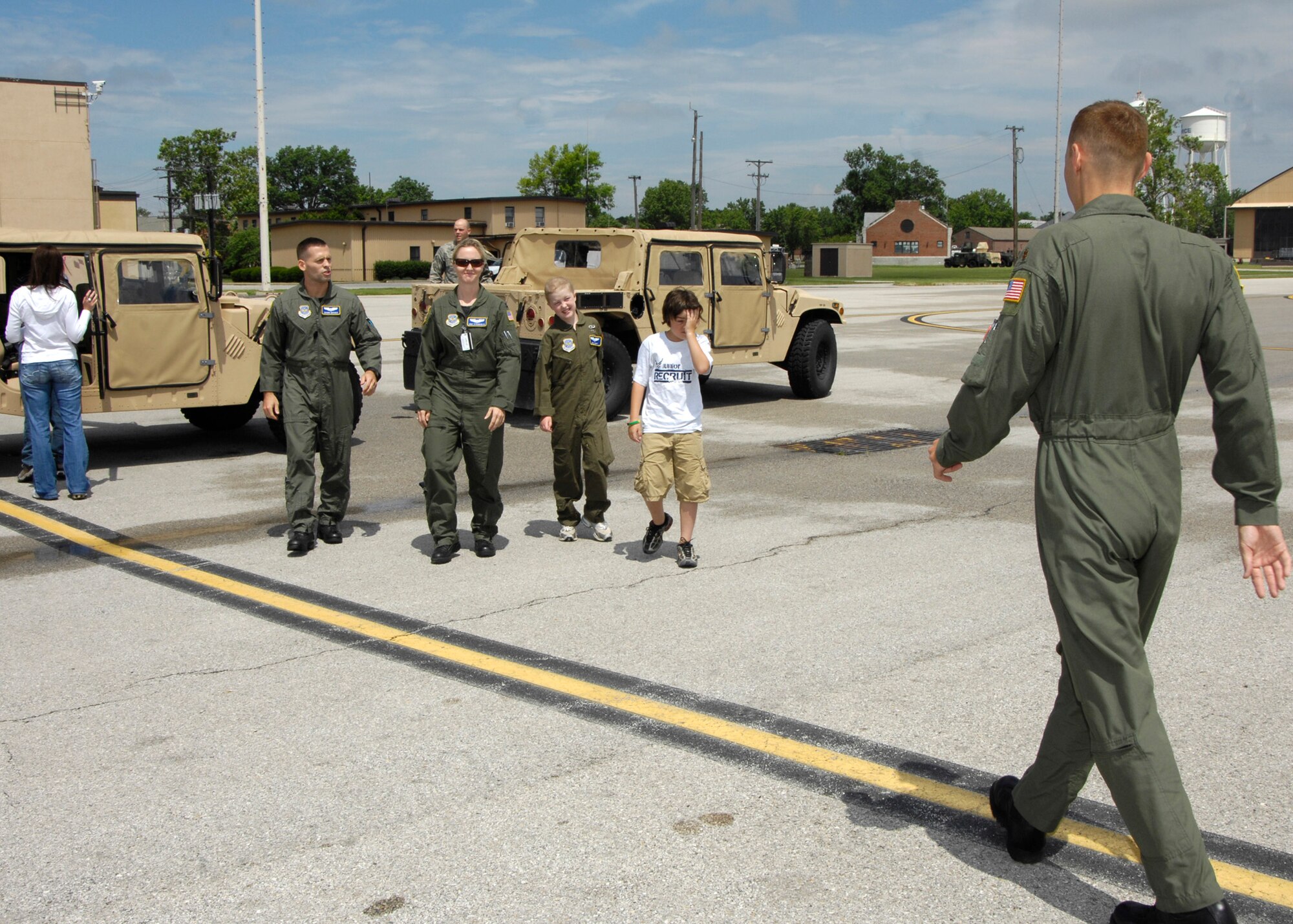 SCOTT AIR FORCE BASE, Ill. -- Maj. Tony Torres, 458th Airlift Squadron pilot, meets Emily Berry on her Pilot for a Day experience, along with her twin brother Harrison Berry, Capt. Shawn Mosher and Capt. Gina Stramaglio, also 458th Airlift Squadron pilots, at the flightline. 
(US Air Force photo/Senior Airman Mildred Guevara)