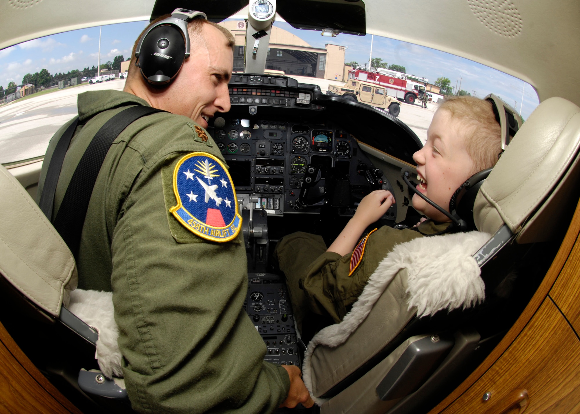 SCOTT AIR FORCE BASE, Ill. -- Maj. Tony Torres, 458th Airlift Squadron pilot, guides Emily Berry, Pilot for a Day guest, through the pre-flight checklist before taxiing across the flightline in the C-21 aircraft. 
(US Air Force photo/Senior Airman Mildred Guevara)