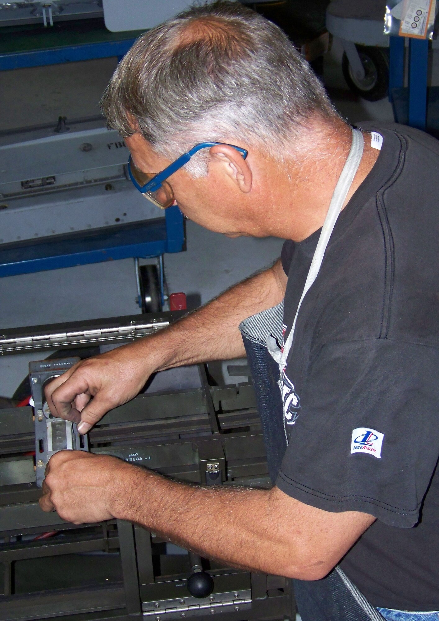 Richard Taliaferro, an Air Reserve Technician and technical sergeant in the 917th Armament Shop, replaces the cover of a round counter with one made of plexiglas Monday, June 23. (U.S. Air Force photo/Master Sgt. Sherri Bohannon)