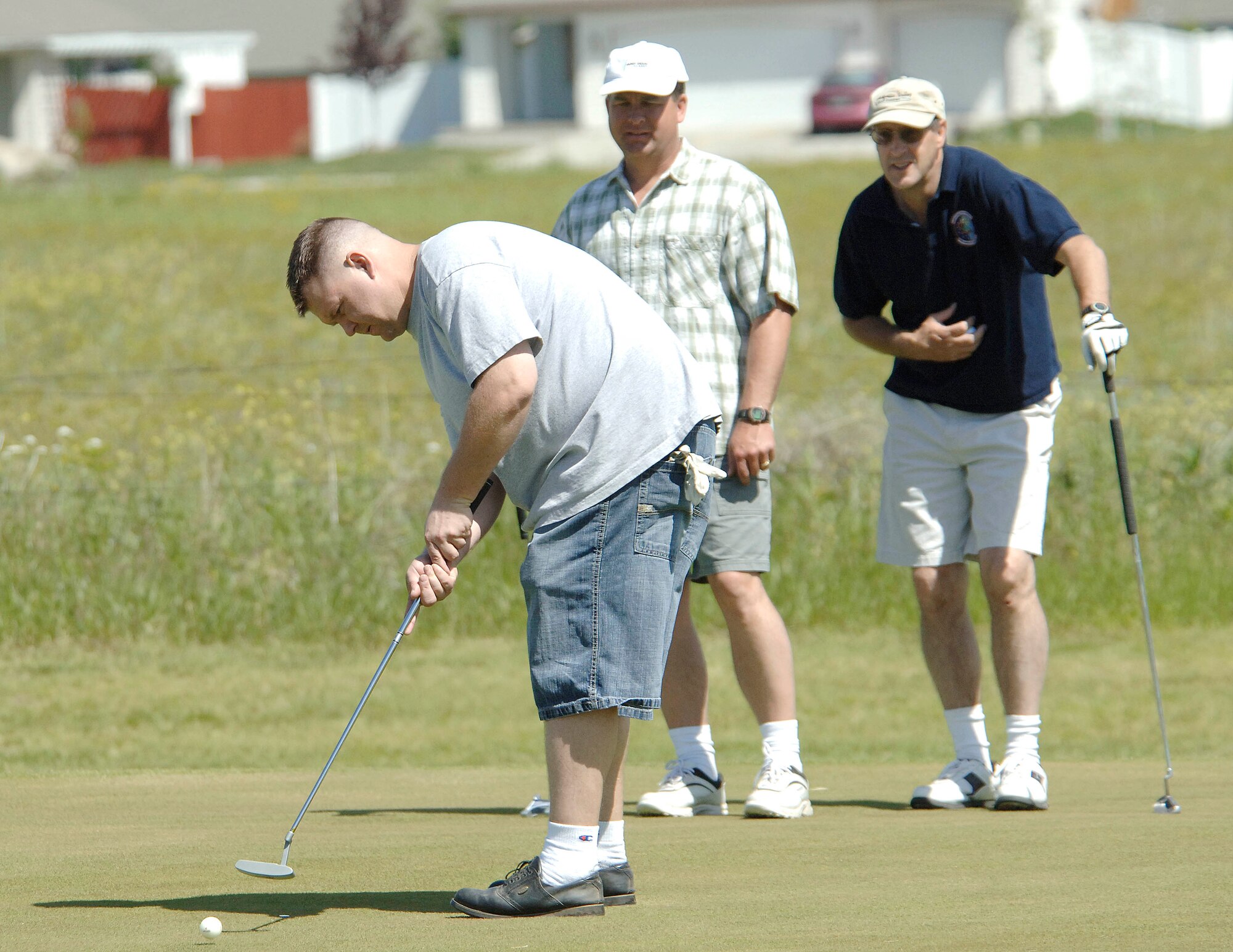 FAIRCHILD AIR FORCE BASE, Wash. – Tech. Sgt. William Whetton, 92nd Mission Support Squadron assistant section chief, putts the golf ball as Charles Kienbaum, 92nd MSS, and Dennis Johnson, 92nd MSS, look on during Fairchild’s Air Force Sergeants’ Association golf tournament June 20. The event was held at Fairways golf course Cheney, Wash. The AFSA is an enlisted organization that ensures the entitlements the enlisted personnel receive upon joining the U.S. Air Force are maintained throughout their career into retirement. (U.S. Air Force photo / Staff Sgt. JT May III)