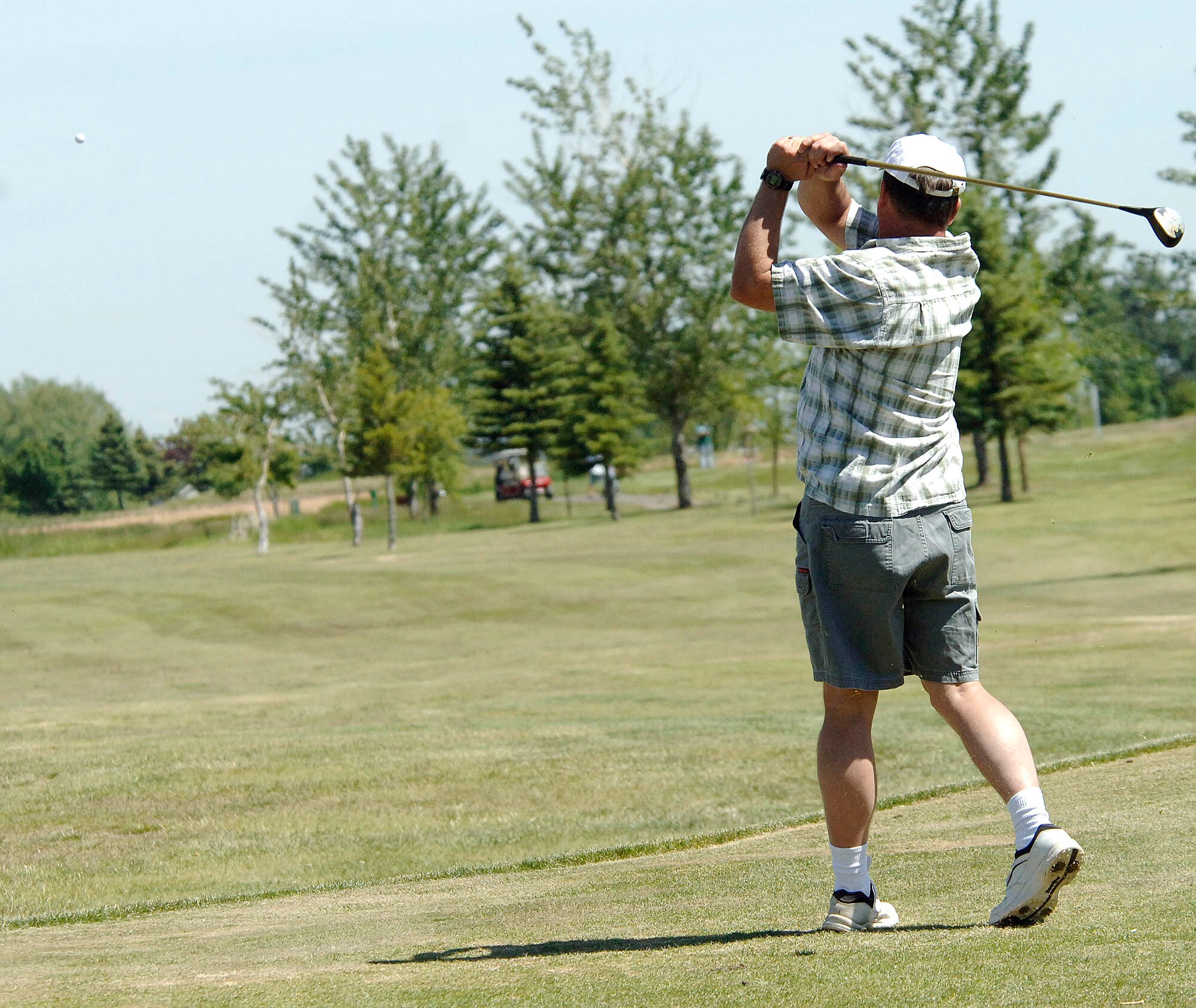 FAIRCHILD AIR FORCE BASE, Wash. – Dennis Johnson, 92nd Mission Support Squadron, drives the ball down the fairway during Fairchild’s Air Force Sergeants’ Association golf tournament. The event was held at Fairways golf course Cheney, Wash., June 20. The AFSA is an enlisted organization that ensures the entitlements the enlisted personnel receive upon joining the U.S. Air Force are maintained throughout their career into retirement. (U.S. Air Force photo / Staff Sgt. JT May III)

