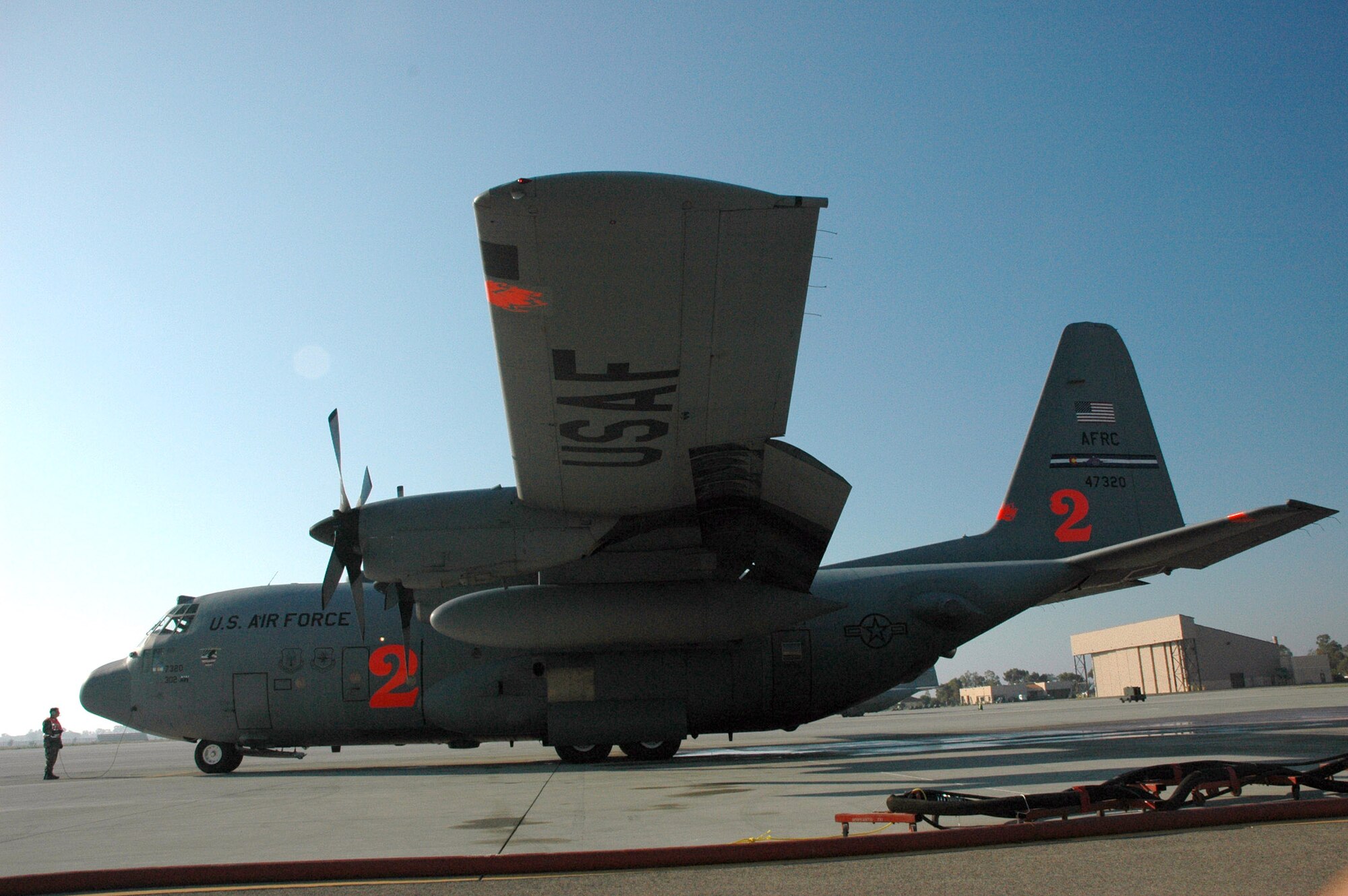 Two Modular Airborne Firefighting System configured C-130 Hercules from the Air Force Reserve Command's 302nd Airlift Wing at Peterson Air Force Base, Colo., are being dispatched to California to help fight wildfires there. In 2007 the 302nd AW flew 76 sorties against fires in Southern California discharging more than 200,000 gallons of retardant protecting more than 2,000 homes, saving thousands of lives and preventing an estimated $1.1 billion in property loss. (U.S. Air Force photo/Capt. Jody L. Ritchie) 