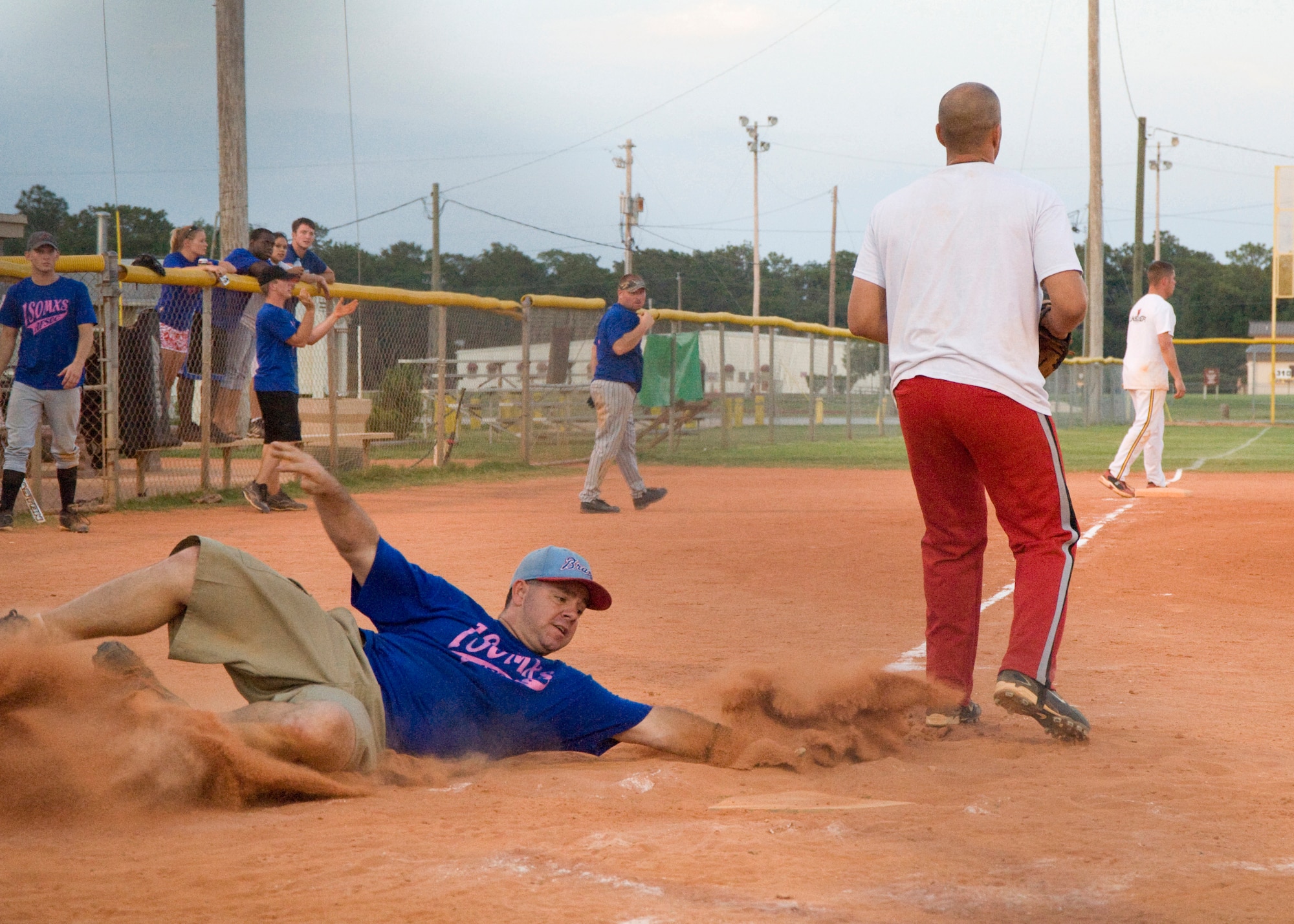EGLIN AIR FORCE BASE, Fla. -- Melvin Bryant, a softball player with the 1st Special Operations Maintenance Squadron, slides into base against a team member from the 96th Logistics Readiness Squadron, during the Eglin Intramural Softball Championship game June 19. The 1st SOMXS team claimed victory over 96 LRS with a final score of 29-11. (U.S. Air Force photo by Wendell Rowan)