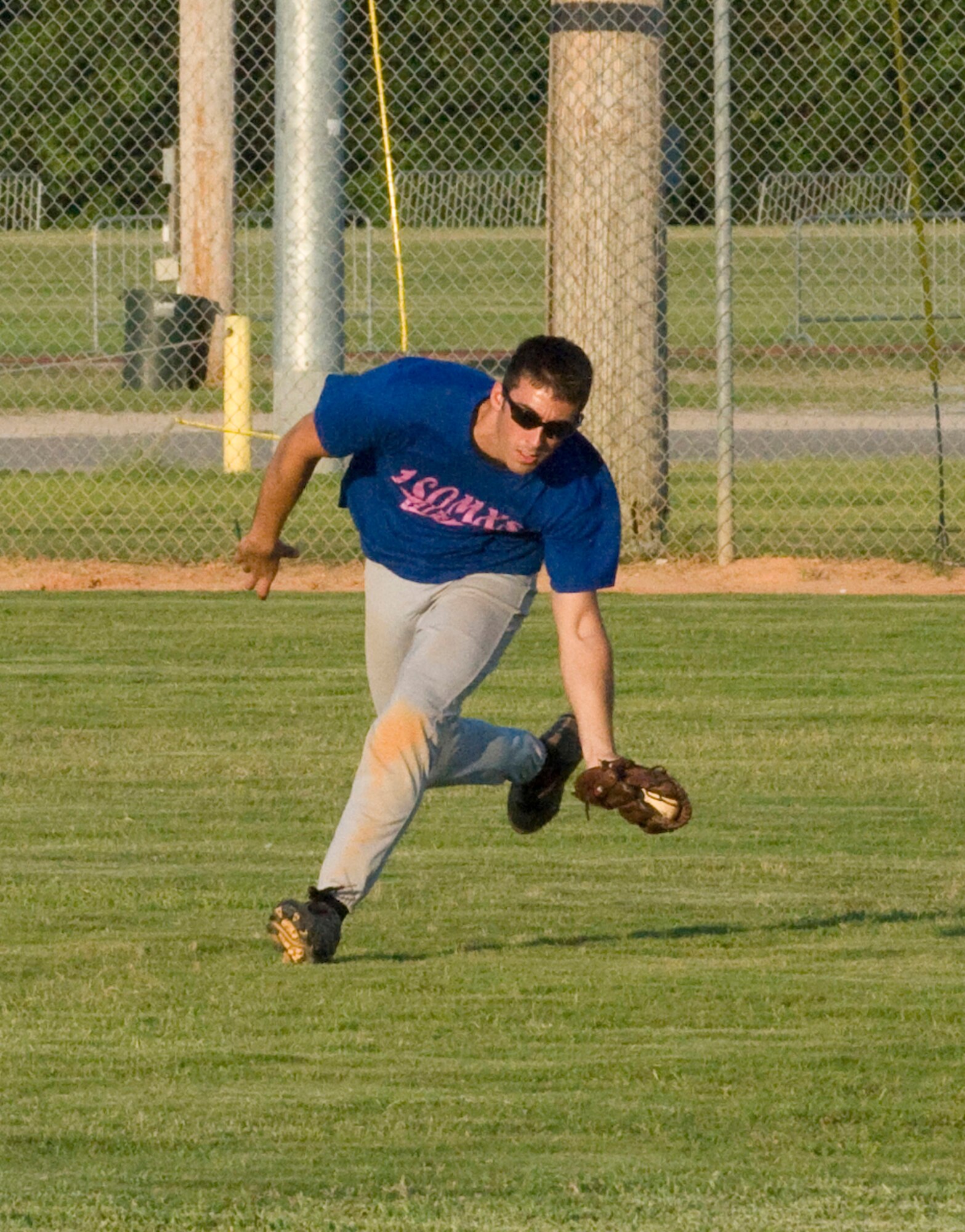 EGLIN AIR FORCE BASE, Fla. -- Andy Schloemer, 1st Special Operations Maintenance Squadron, races to catch a ball during the Eglin Intramural Softball Championship game June 19. The Special Operations team squared off against the 96th Logistics Readiness Squadron and emerged victorious with a winning score of 29-11. (U.S. Air Force photo by Wendell Rowan)