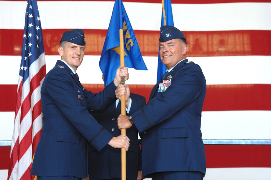 DYESS AIR FORCE BASE, Texas -- Col. Timothy Ray, 7th Bomb Wing commander, gives command of the 7th Maintenance Group to Col. James Milburn June 20. (U.S. Air Force photo by Airman 1st Class Stephen Reyes)