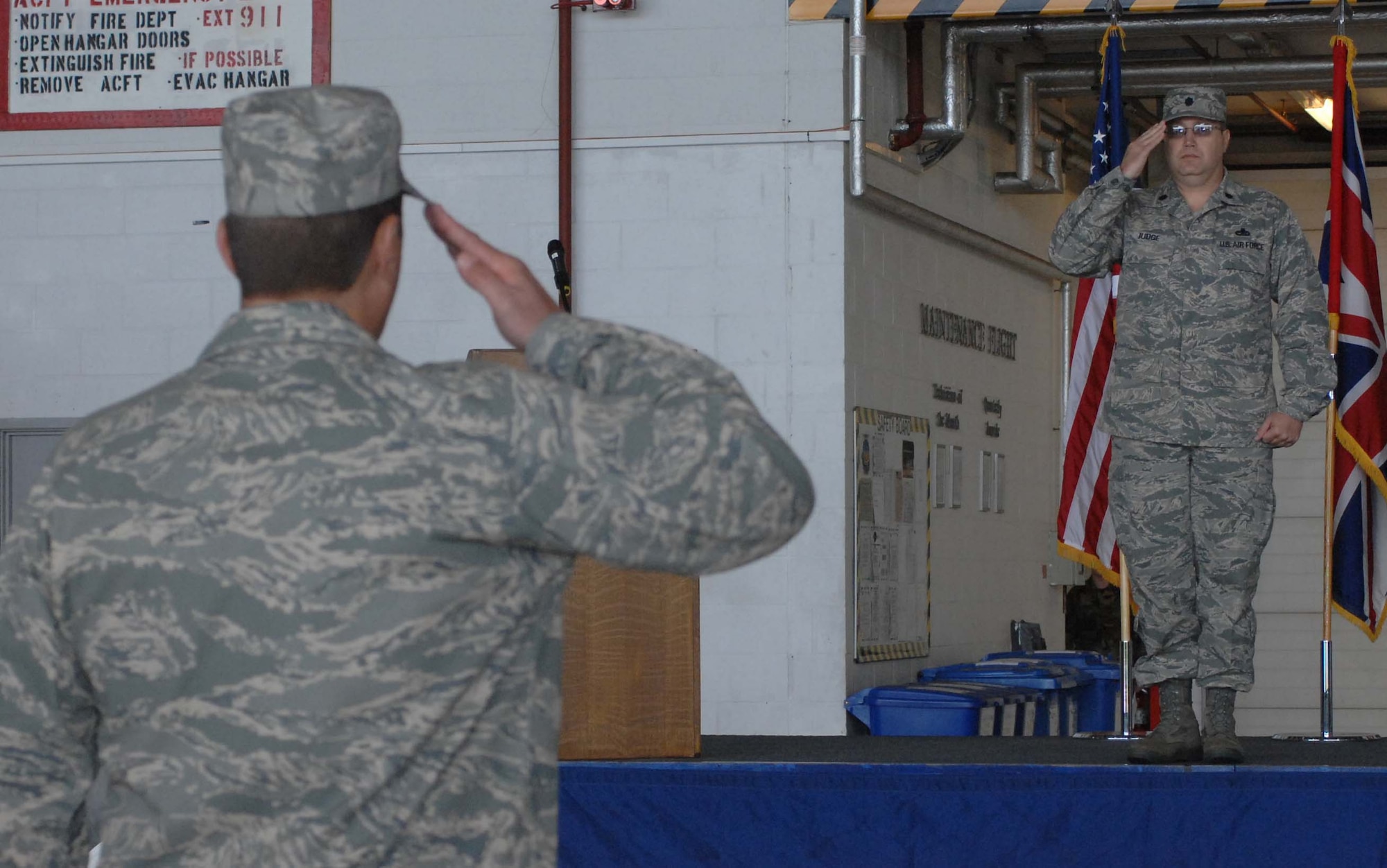 Lt. Col. Dean R. Judge, 352nd Maintenance Squadron commander, takes his first salute as leader of the maintenance squadron from Capt. Eric Nimke, 352nd MXS operations officer and the formation's commander (back to the camera) for the Assumption of Command ceremony held in Hangar 803 June 12. (U.S. Air Force photo Airman 1st Class Brad Smith)