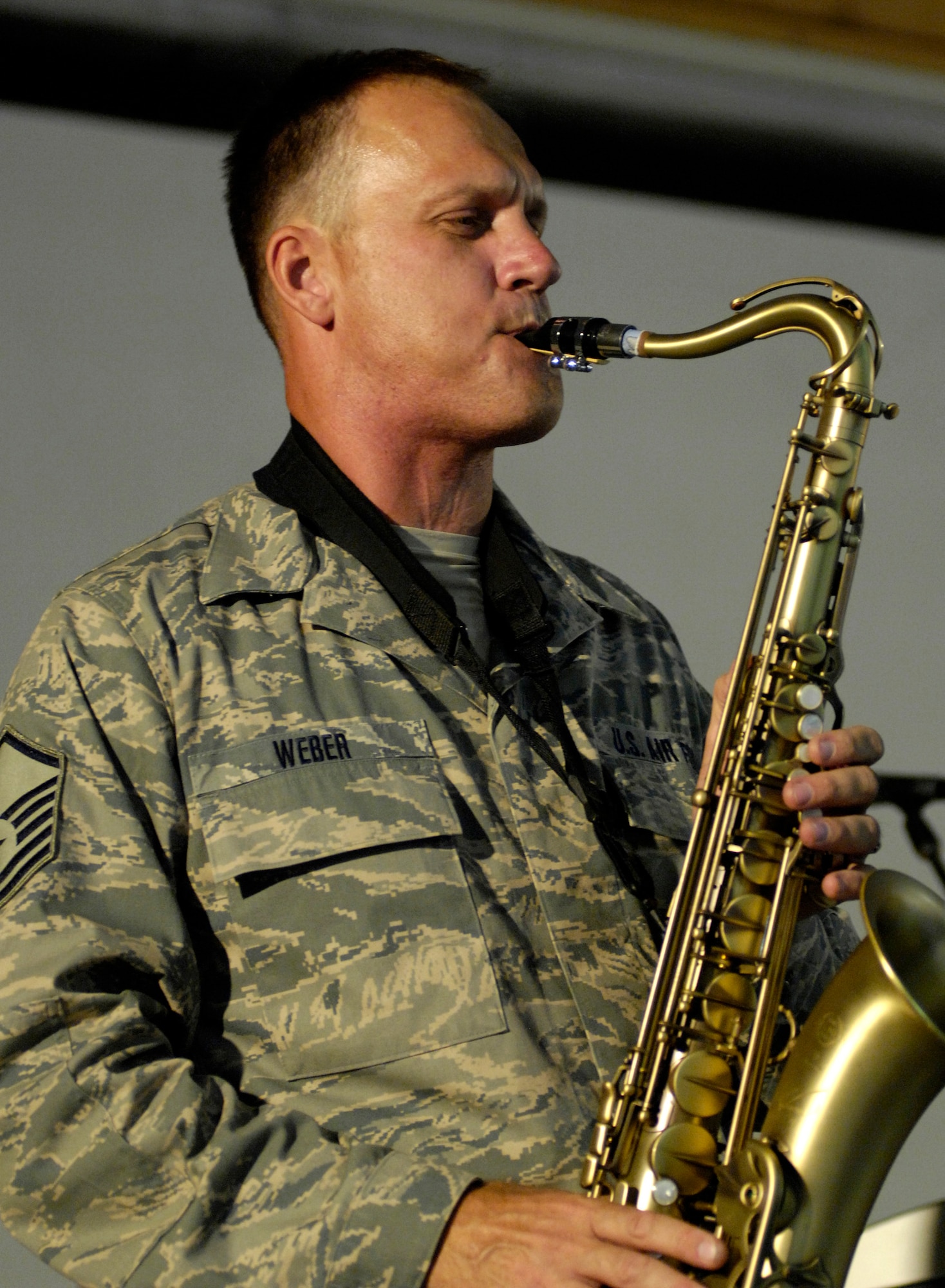 BAGRAM AIR FIELD, Afghanistan – Master Sgt. Daniel Weber, U.S. Air Forces Band ‘Falcon’ saxophonist, delivers a crowd pleasing solo during a show here June 22.  ‘Falcon’ travels throughout the area of responsibility positively promoting troop morale, diplomacy and reach out to host nation communities.  (U.S. Air Force photo by Master Sgt. Demetrius Lester)