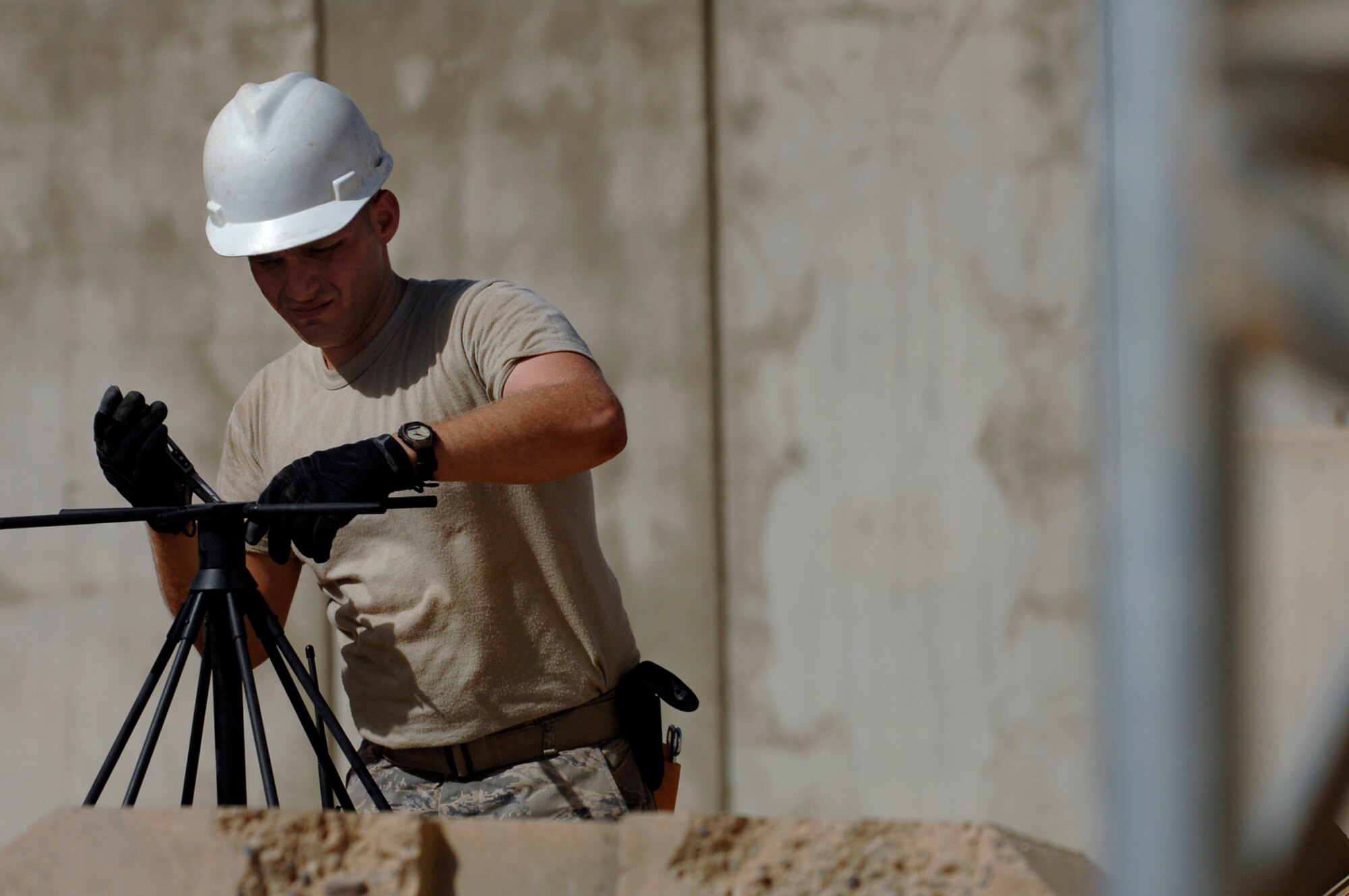 JOINT BASE BALAD, Iraq -- Senior Airman Michael Lee, 332nd Expeditionary Communications Squadron ground radio maintainer, pieces together an ultra high frequency radio used for line of sight tactical radio communications used for ground operations here, June 21. Airman Lee is deployed from Lajes Field, Azores. (U.S. Air Force photo/ Senior Airman Julianne Showalter)