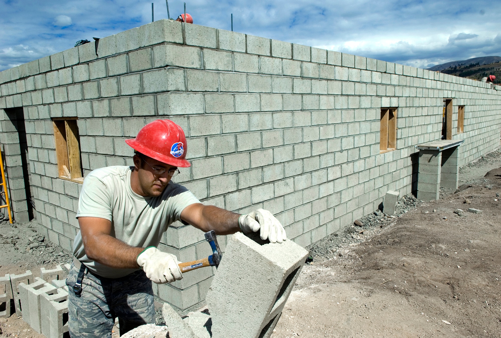 Tech. Sgt. Devan Chuvnoski prepares cinder blocks for the building of a medical clinic in Yanama, Peru, June 23 during New Horizons-Peru 2008, a U.S. and Peruvian partnered humanitarian mission set on providing relief to underprivileged Peruvians. Sergeant Chuvnoski is a civil engineer with the 820th RED HORSE Squadron at Nellis Air Force Base, Nev. (U.S. Air Force photo/Staff Sgt. Bennie J. Davis III)