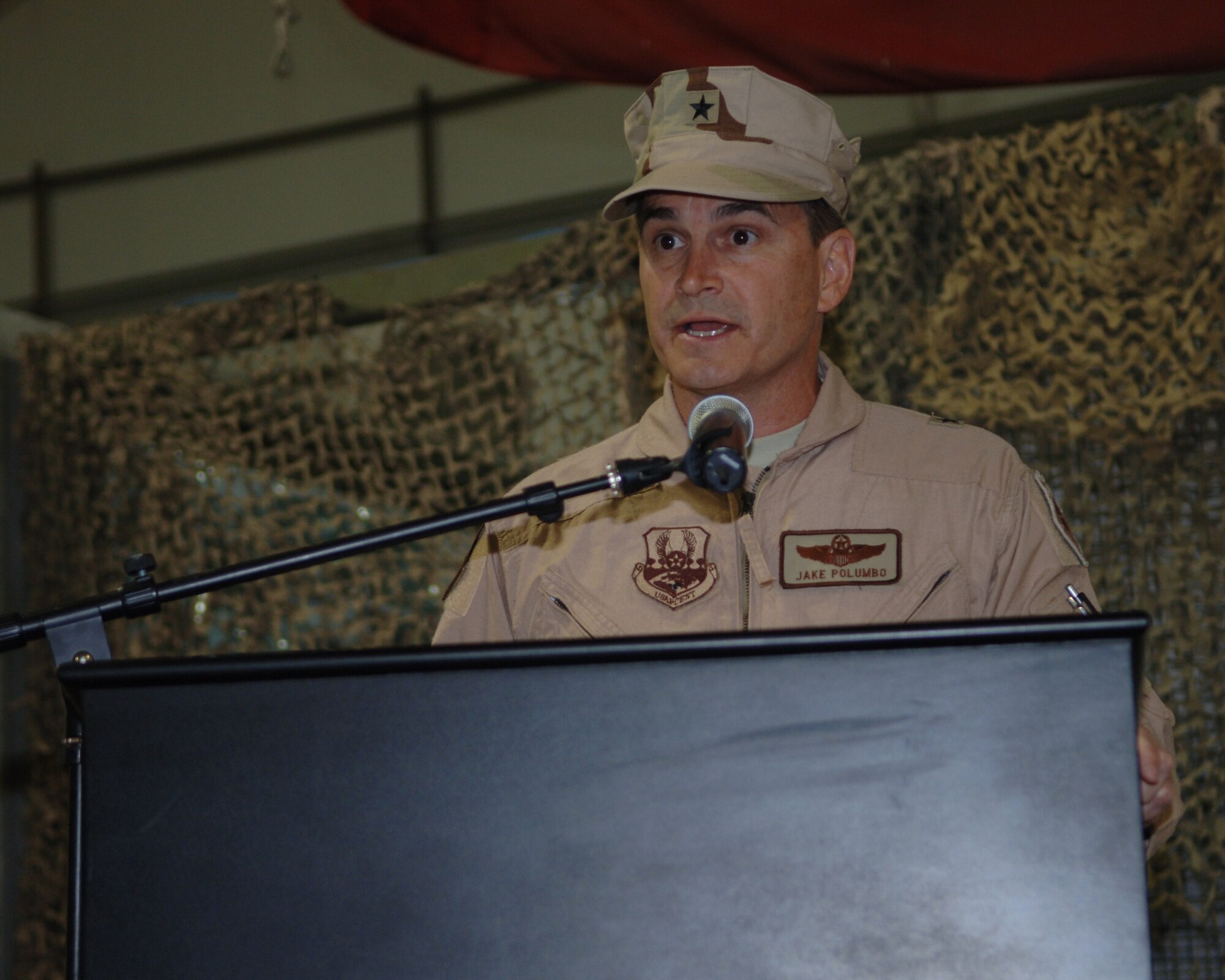 Brig. Gen. H.D. Polumbo, Jr., 380th Air Expeditionary Wing commander, speaks during the change of command ceremony,  June 16. (U.S. Air Force photo/Airman 1st Class Kelly LeGuillon)