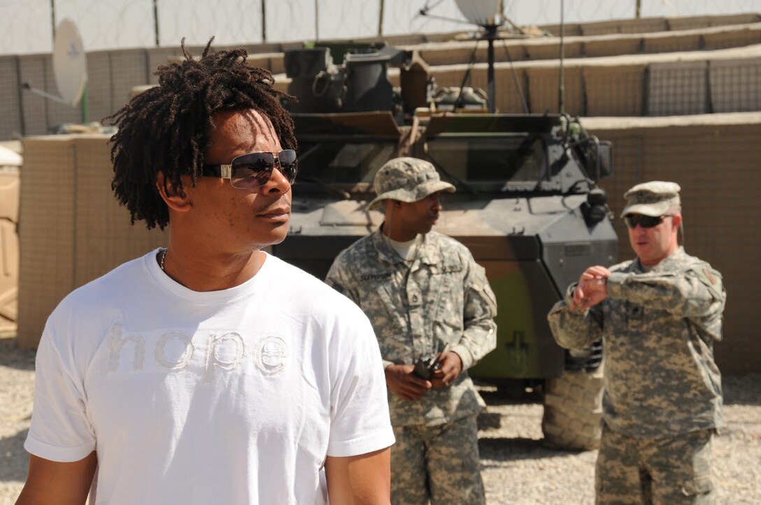 Eric Davis, former defensive back for the National Football League’s San Francisco 49ers, visits Forward Operating Base Lightning, Afghanistan, June 24, 2008. Davis and 49ers head coach Mike Nolan came as guests on the Ron Barr talk show to visit deployed troops. Combined Security Transition Command Afghanistan Morale, Welfare and Recreation department sponsored the event. Photo by Navy Seaman Tim Newborn, Combined Security Transition Command Afghanistan