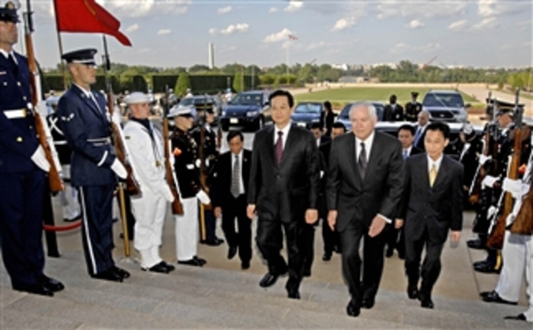 Secretary of Defense Robert M. Gates escorts Vietnamese Prime Minister Nguyen Tan Dung (left) through an honor cordon and into the Pentagon on June 24, 2008.  Gates and Dung will meet to discuss a range of regional security issues of mutual interest to both nations.  
