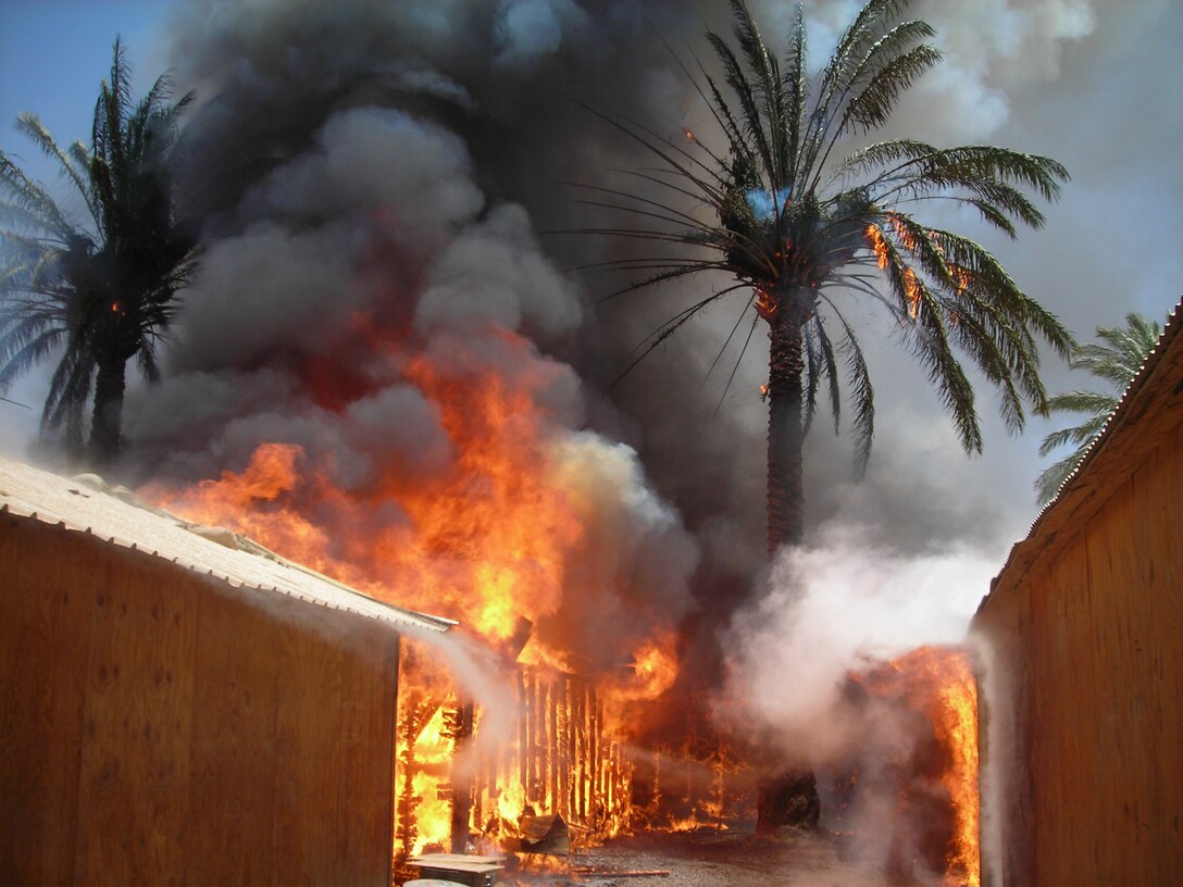 FALLUJAH, Iraq (June 25, 2008) – Structures burn June 25 at Entry Control Point-5 (ECP-5), a post where Marines and Iraqi Police safeguard entrants into the city of Fallujah. Despite Marine and Iraqi firemen efforts, the fire destroyed most structures at the compound over watched by Company L, 3rd Battalion, 6th Marines and Iraqi policemen. The company said they received overwhelming support from Iraqi locals and from stateside supporters. (Official U.S. Marine Corps photo by Company L, 3rd Battalion, 6th Marines) (RELEASED)